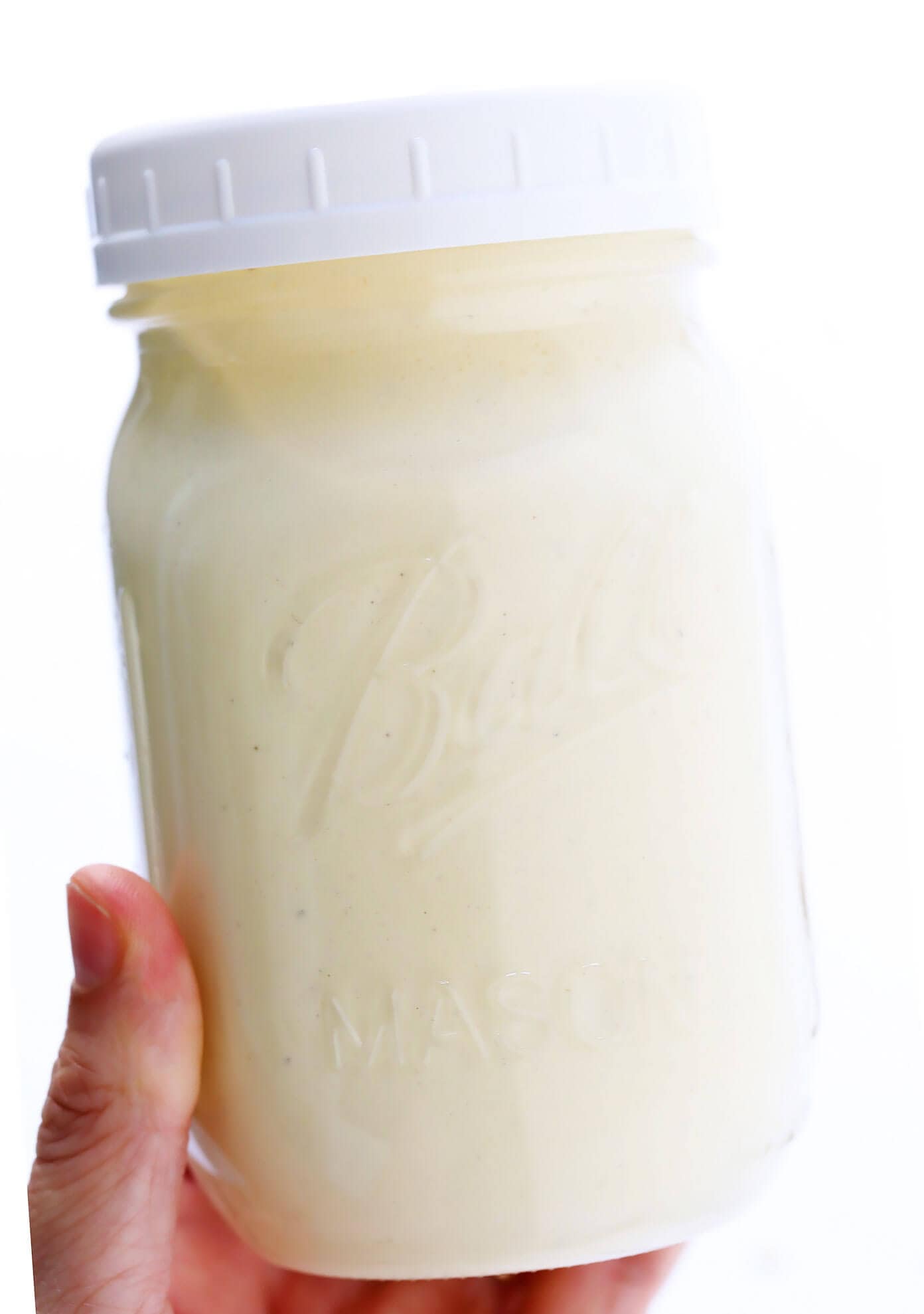 The BEST Caesar Dressing recipe -- quick and easy to make, full of the best creamy, savory, umami flavors, and downright irresistible on a classic Caesar salad. | gimmesomeoven.com #caesar #salad #dressing #creamy #italian #dinner #recipe Jar of Homemade Caesar Dressing