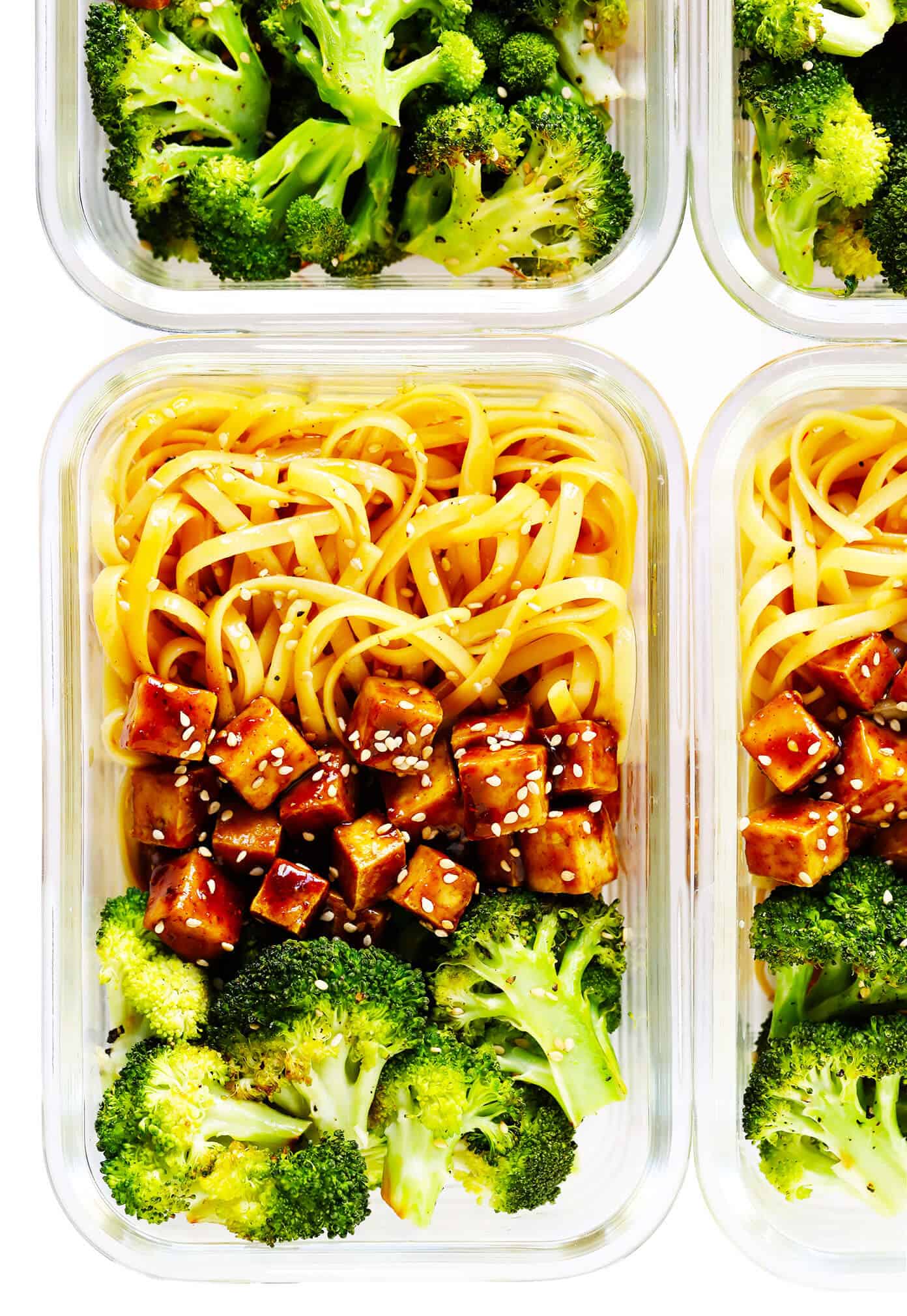 Crispy tofu is tossed with a flavor-packed sweet and savory sauce (made with hoisin, rice vinegar and five spice) and served over my favorite sesame noodles. It's perfect for a weeknight dinner or easy meal prep! (Feel free to use chicken, pork, beef, shrimp, salmon or tempeh in place of the tofu if you prefer.) | gimmesomeoven.com #tofu #noodles #sesame #asian #broccoli #dinner #healthy #vegan #vegetarian #healthy #mealprep #bowl #stirfry Five Spice Tofu Sesame Noodle Bowls with Roasted Broccoli in Meal Prep Containers