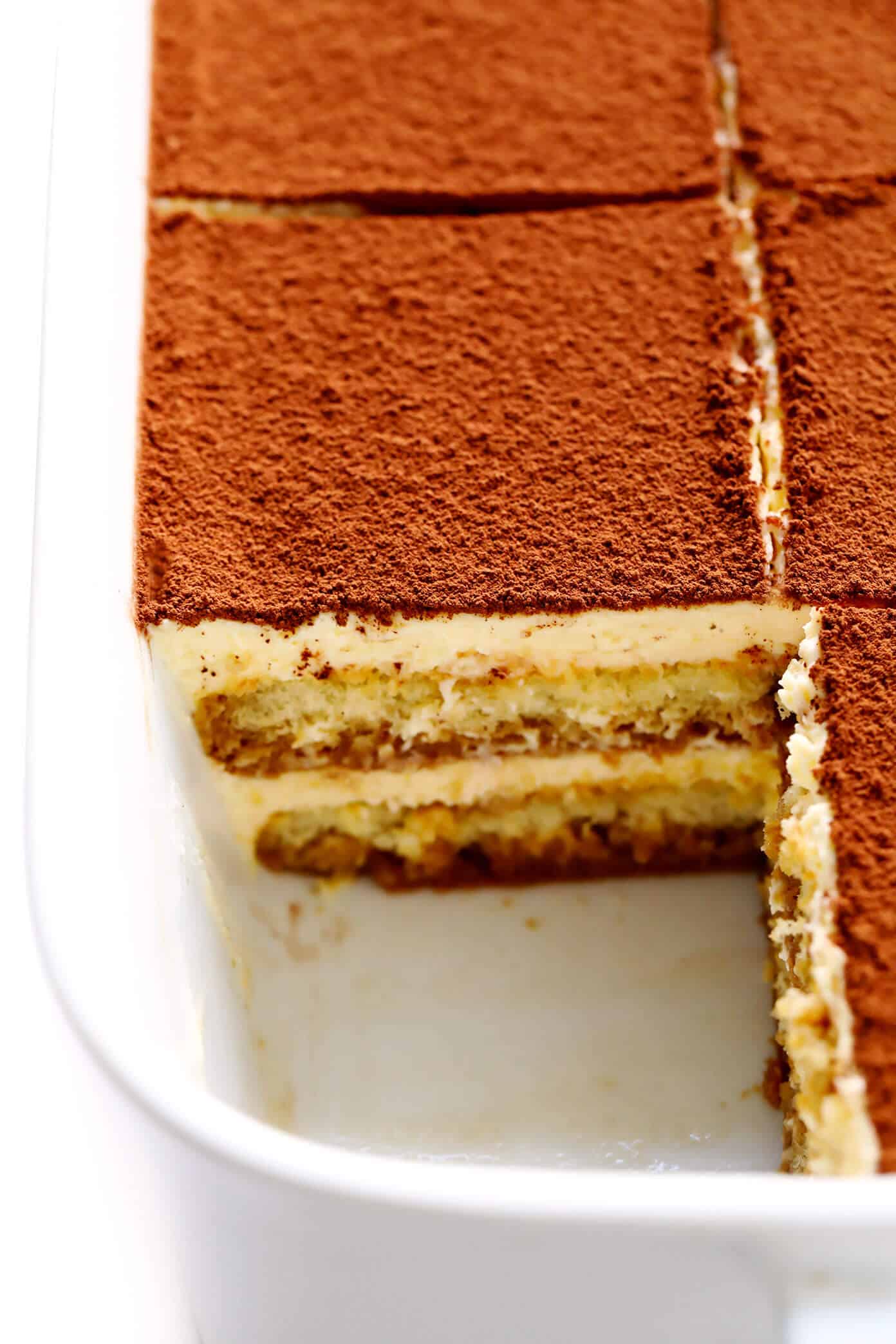 This tiramisu recipe is easy to whip up, this version is made with cooked (instead of raw) eggs, and it tastes just as indulgent and delicious as ever. The perfect make-ahead dessert for Italian night! | gimmesomeoven.com #tiramisu #italian #dessert #mascarpone #nobake #chocolate #vegetarian Tiramisu in the pan