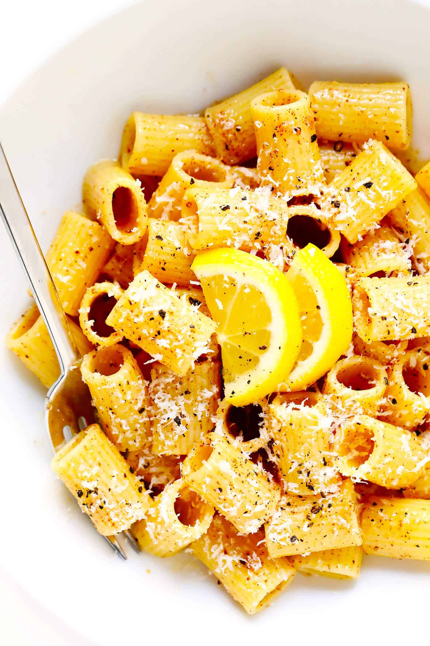 This Brown Butter Lemon Pasta recipe is easy to make with 5 ingredients in less than 30 minutes and tastes absolutely divine. It's the perfect quick dinner when you're craving Italian comfort food! Feel free to add veggies or a protein (chicken, salmon, shrimp, etc) too. | gimmesomeoven.com #pasta #lemon #brownbutter #italian #vegetarian #easy #dinner Lemon Pasta Closeup In Serving Dish