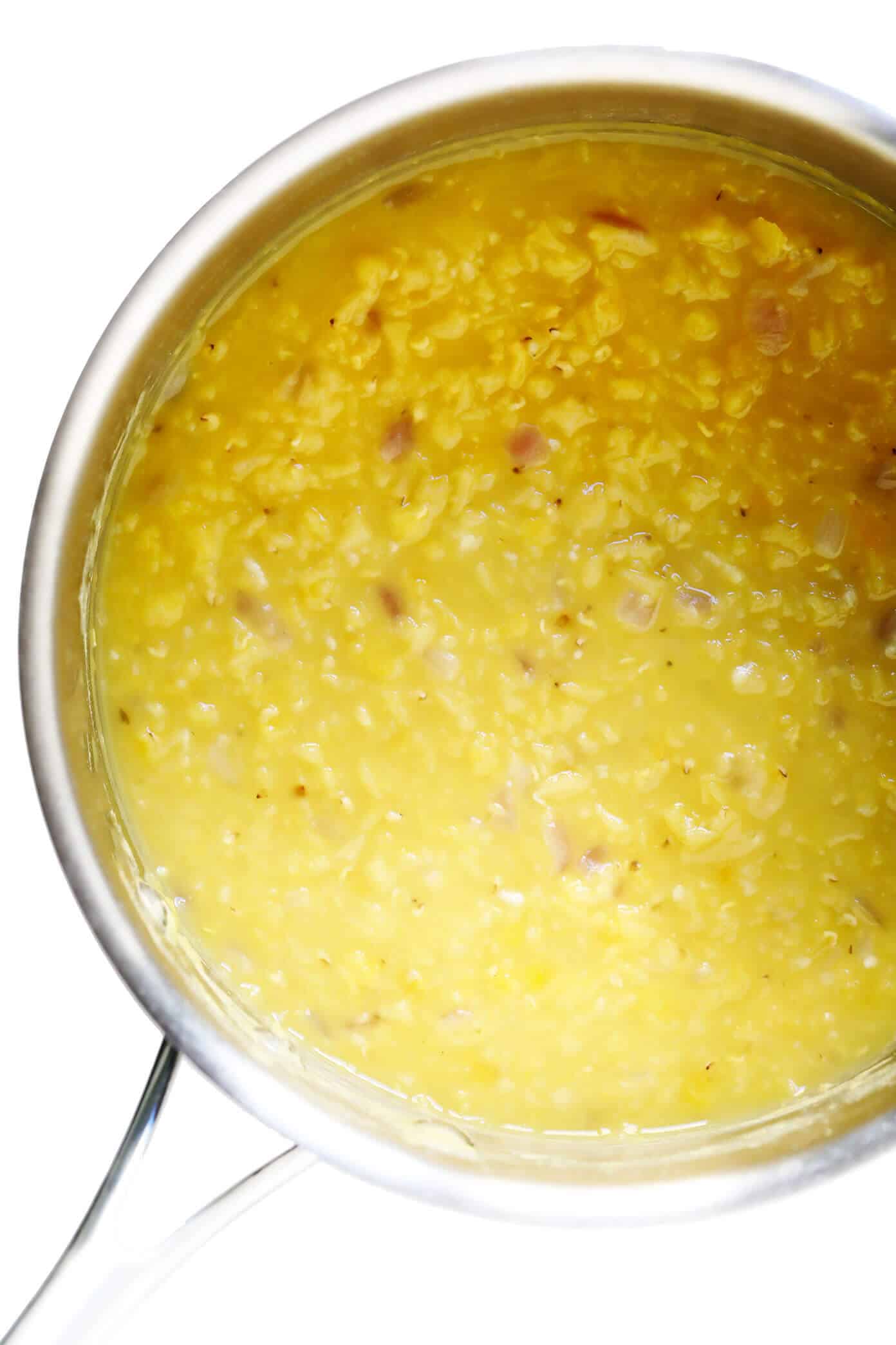 This Greek Fava (Yellow Split Pea Dip) recipe tastes refreshingly light, lemony and zesty, and is the perfect appetizer or side dish for serving with pita bread or any of your favorite dippers. | gimmesomeoven.com #greek #fava #santorini #splitpea #dip #spread #appetizer #healthy #vegan #glutenfree #vegetarian Yellow split peas simmering for Greek fava