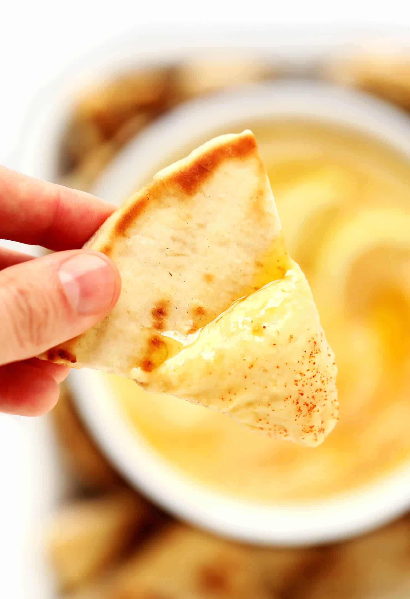 This Greek Fava (Yellow Split Pea Dip) recipe tastes refreshingly light, lemony and zesty, and is the perfect appetizer or side dish for serving with pita bread or any of your favorite dippers. | gimmesomeoven.com #greek #fava #santorini #splitpea #dip #spread #appetizer #healthy #vegan #glutenfree #vegetarian Greek Fava Dip with Pita Closeup