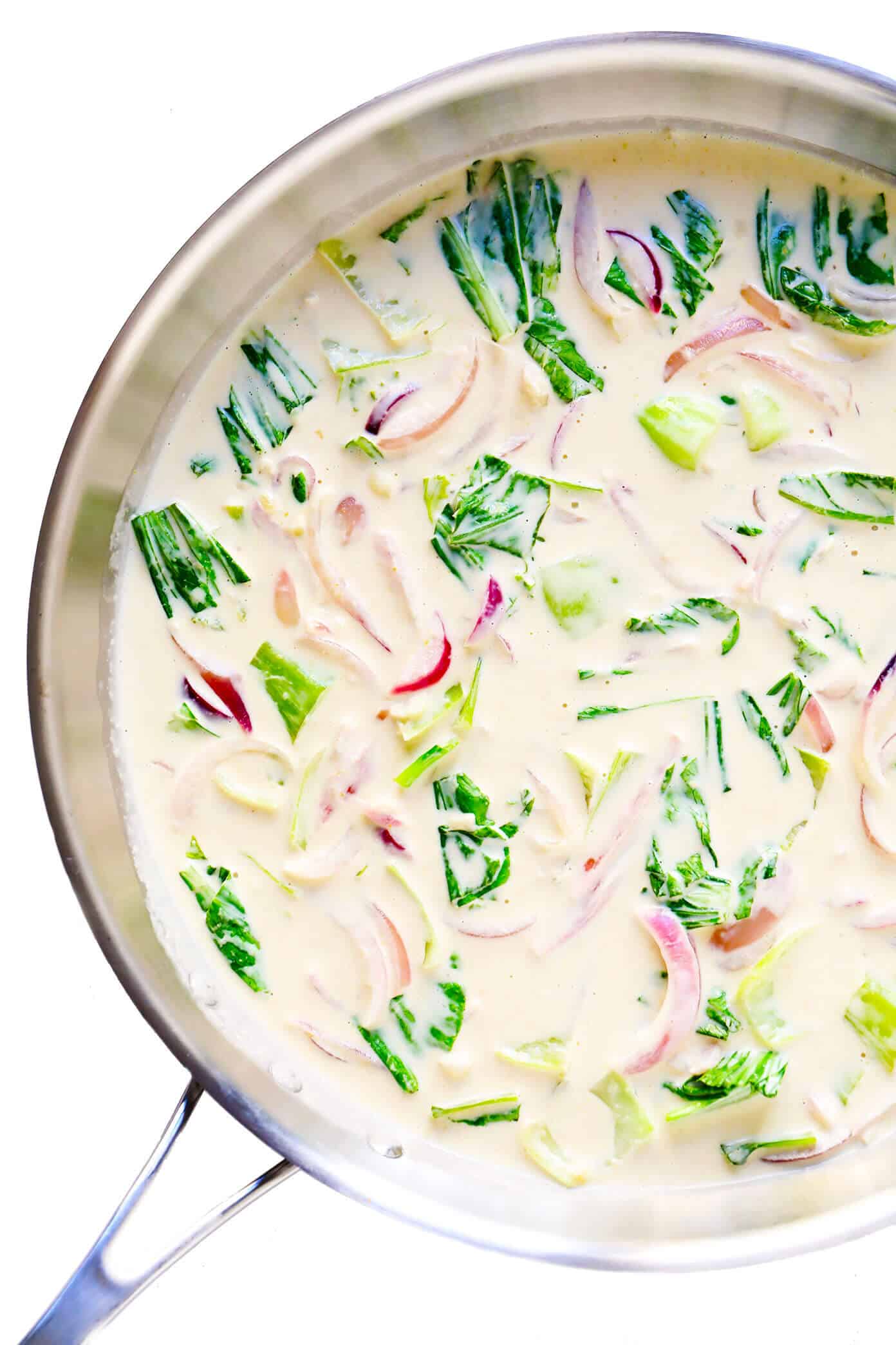 This quick and easy Green Curry Salmon recipe is made with tender salmon, fresh baby bok choy, and the most delicious Thai-inspired lime coconut green curry sauce. Ready to go in less than 30 minutes! | gimmesomeoven.com #salmon #curry #sauce #coconut #glutenfree #dinner #healthy #glutenfree Green Curry Sauce with Bok Choy and Red Onions