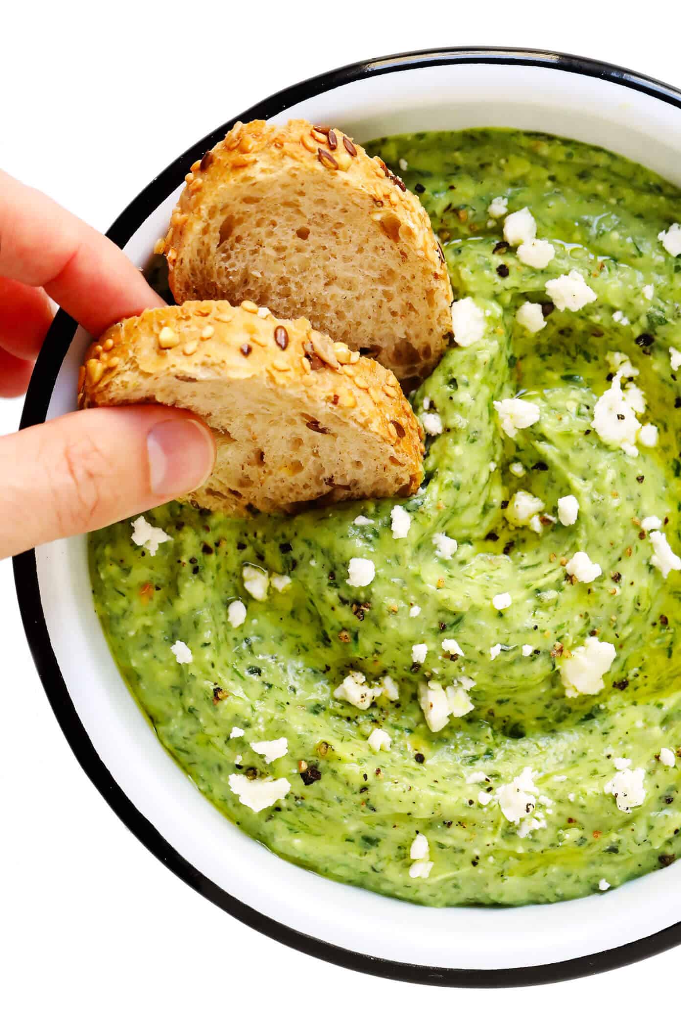 This Green Goddess Feta Dip recipe is packed with tons of fresh herbs (basil, mint, dill), creamy avocado, and lots of tangy lemon and feta. Serve it up with crusty bread, veggies, crackers or any of your favorite dippers! | gimmesomeoven.com #greengoddess #avocado #dip #spread #summer #feta #cheese #vegetarian #glutenfree #appetizer #mediterranean Green Goddess Feta Dip with Crusty Bread Dippers