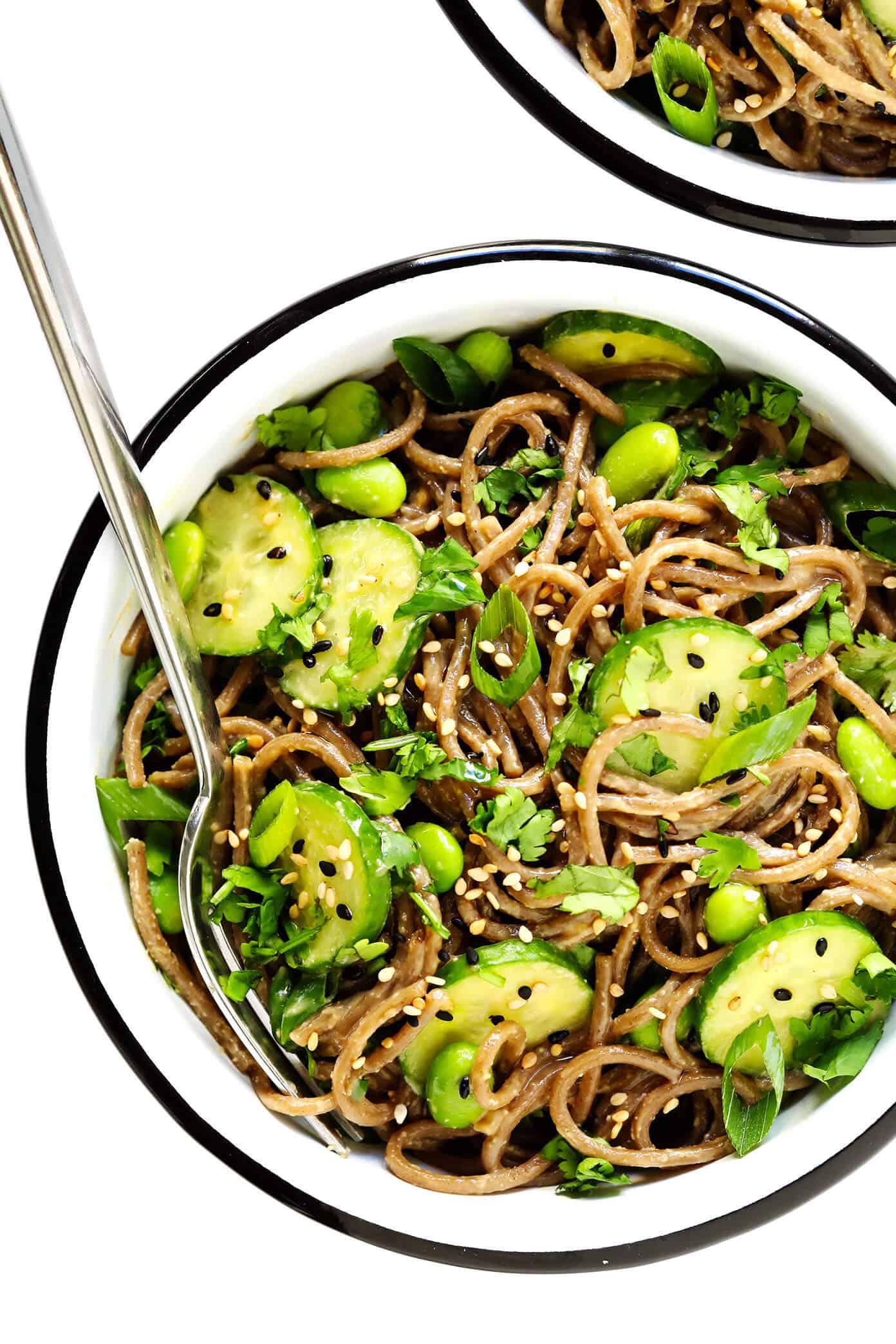 These chilled peanut soba noodles are tossed with cucumber, edamame, fresh herbs and an irresistible peanut sauce...and ready to go in just 20 minutes! Feel free to add extra veggies or a protein (salmon, shrimp, chicken, etc) if you would like. | gimmesomeoven.com #soba #noodles #pasta #salad #healthy #mealprep #glutenfree #vegetarian #vegan #dinner Quick Peanut Soba Noodles