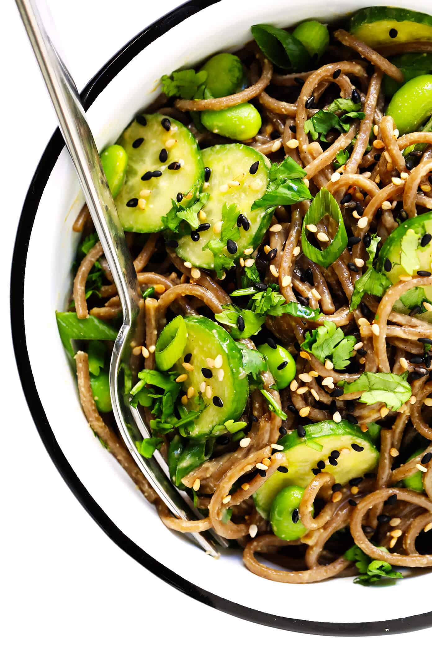 These chilled peanut soba noodles are tossed with cucumber, edamame, fresh herbs and an irresistible peanut sauce...and ready to go in just 20 minutes! Feel free to add extra veggies or a protein (salmon, shrimp, chicken, etc) if you would like. | gimmesomeoven.com #soba #noodles #pasta #salad #healthy #mealprep #glutenfree #vegetarian #vegan #dinner Peanut Soba Noodles Closeup