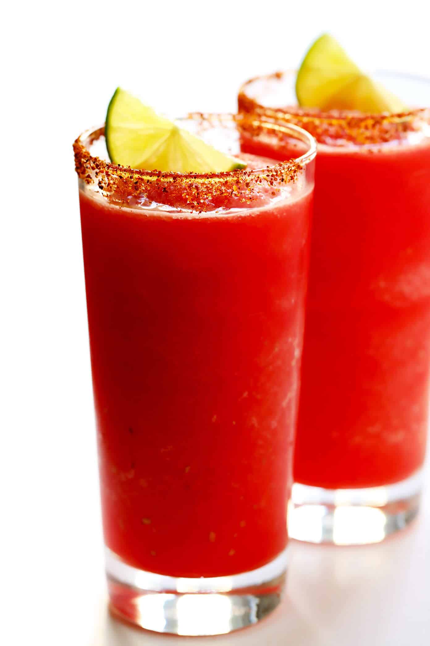 These Watermelon Lime Mocktail recipe is easy to make with just 2 ingredients and kicked up a notch with a fun Tajín rim. It's the perfect frozen slushy for summer! | gimmesomeoven.com #watermelon #mocktail #slushie #slushy #nonalcoholic #drink #frozen #summer Watermelon Lime Mocktails