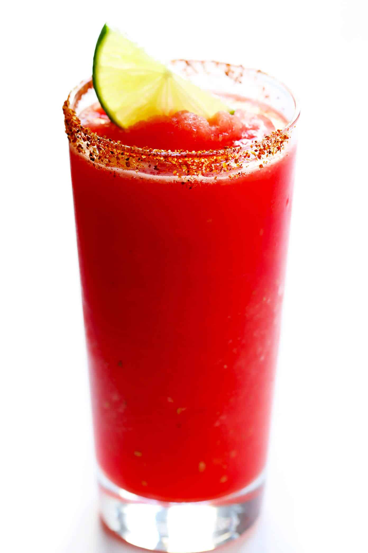 These Watermelon Lime Mocktail recipe is easy to make with just 2 ingredients and kicked up a notch with a fun Tajín rim. It's the perfect frozen slushy for summer! | gimmesomeoven.com #watermelon #mocktail #slushie #slushy #nonalcoholic #drink #frozen #summer Watermelon Lime Slushie Mocktail