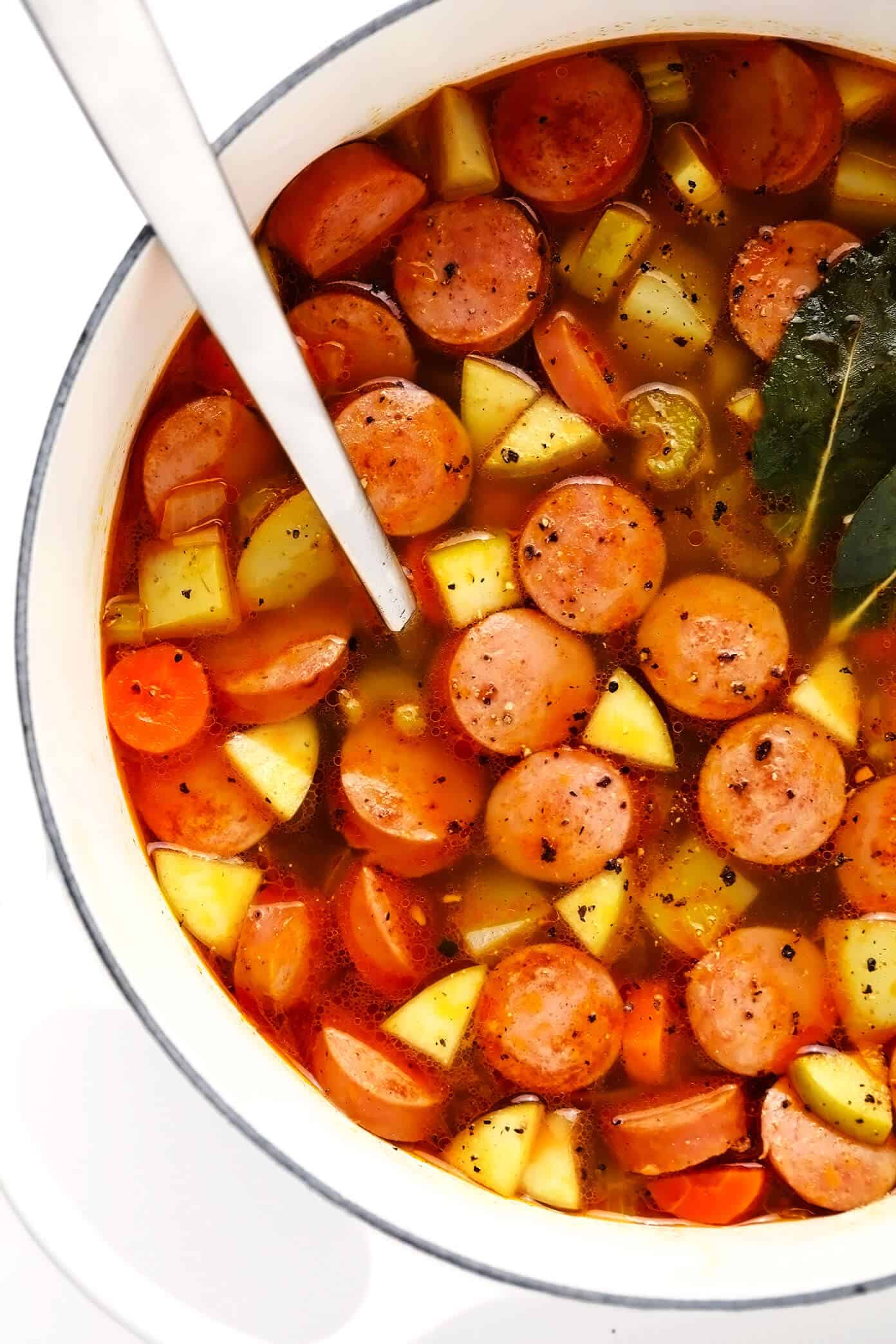 This Smoked Sausage, Apple and Potato Soup recipe is easy to make and simmered in the yummiest creamy broth made with coconut milk (or cream) and zesty Old Bay seasoning. The perfect easy dinner recipe to warm you up on a chilly night! | gimmesomeoven.com Smoked Sausage, Potato and Apple Soup without Cream