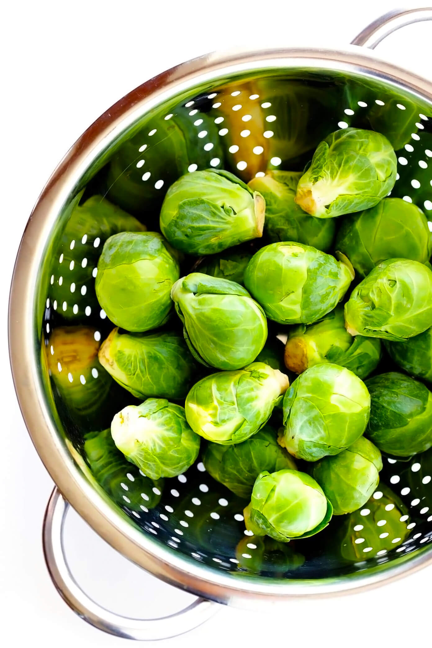 This 30-Minute Brussels Sprouts Parmesan Pasta is made with garlicky shredded Brussels sprouts, toasted pine nuts, and a silky cacio e pepe style cheese and black pepper sauce. It's the perfect easy dinner recipe for fall and winter, and tastes SO delicious. | gimmesomeoven.com #pasta #brussels #vegetarian #italian #cacioepepe #parmesan #sauce #dinner Bowl of Brussels Sprouts