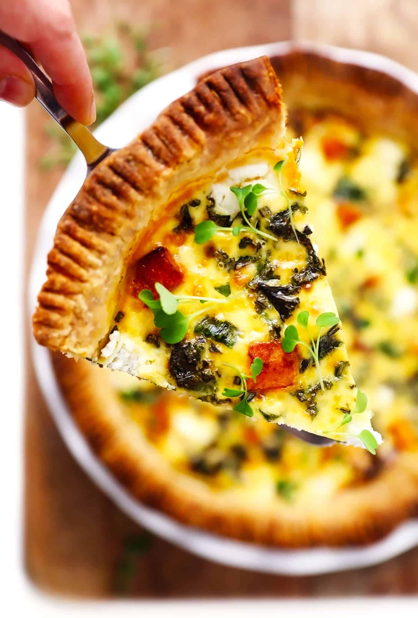 This easy-to-make butternut squash quiche is filled with garlicky kale, goat cheese, rosemary, creamy eggs, and baked in an all-butter pie crust. It's the perfect vegetarian recipe for weekend or holiday brunch and SO delicious. | gimmesomeoven.com #butternut #squash #quiche #breakfast #brunch #egg #bake #vegetarian #thanksgiving #christmas Slice of Butternut Squash Quiche