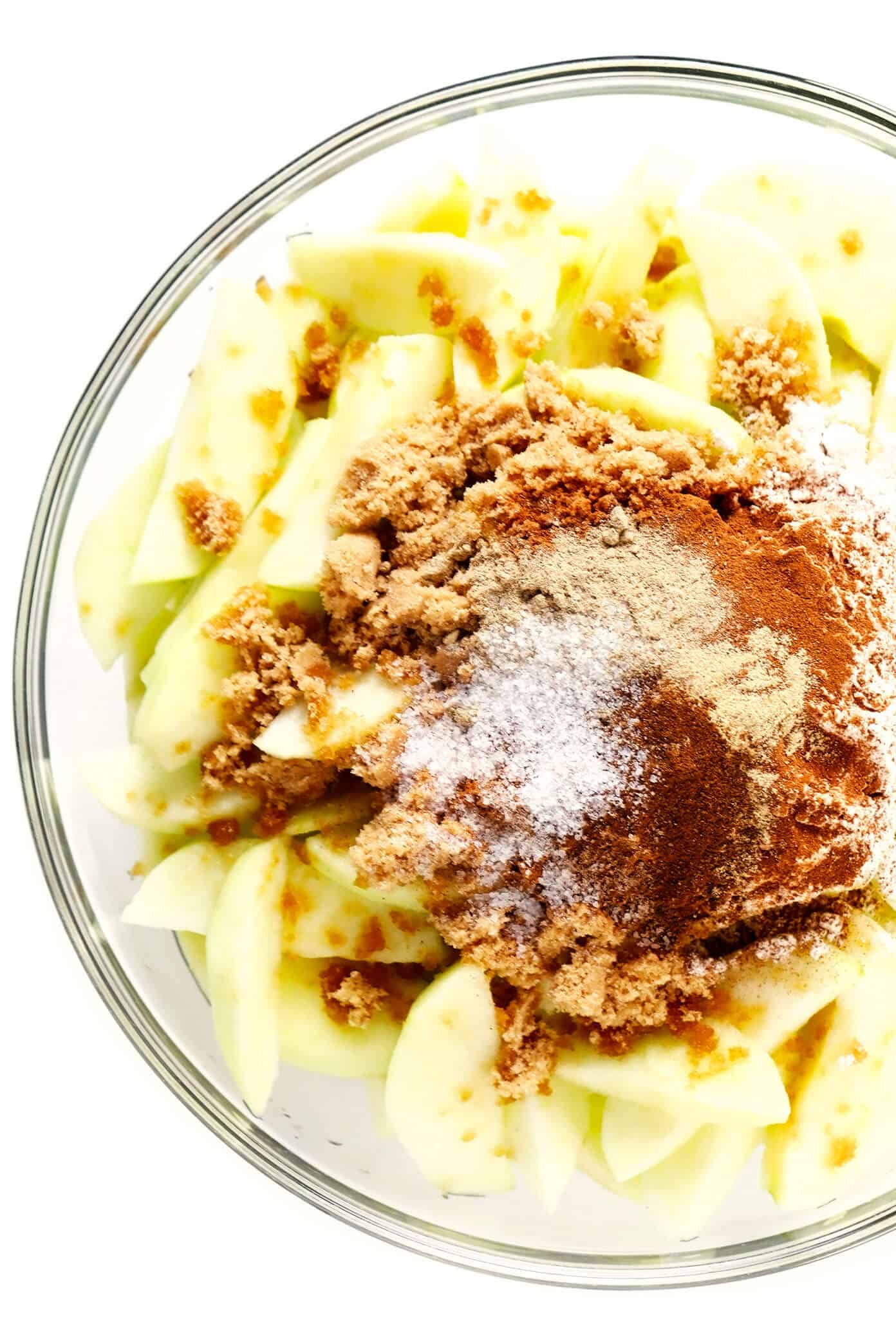 This easy Apple Pandowdy recipe is made with a delicious baked apple cinnamon pie filling topped with toasted puff pastry bites and a light dusting of powdered sugar. Absolutely delicious served warm with vanilla ice cream, and the perfect dessert for the holidays. | gimmesomeoven.com #apple #pandowdy #pie #dessert #bake #crisp #puffpastry #filling #thanksgiving #christmas Apple Pie Filling Ingredients In Bowl