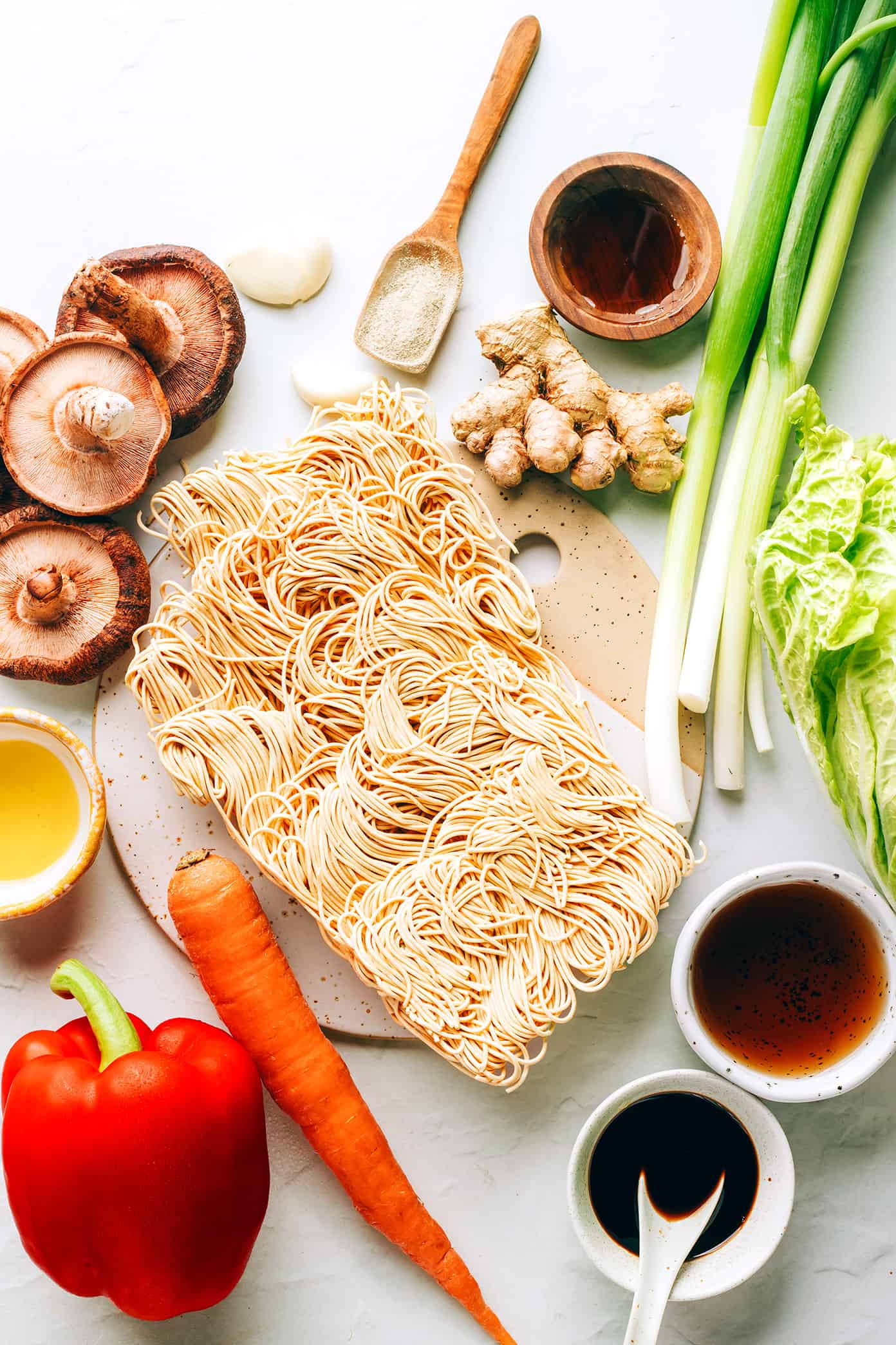 This Chinese-inspired chow mein recipe is easy to whip up in just 25 minutes and tossed with a delicious stir-fry sauce. Feel free to add beef, chicken, pork, shrimp, tofu, or any other extra veggies you might like too! | gimmesomeoven.com Chow mein ingredients