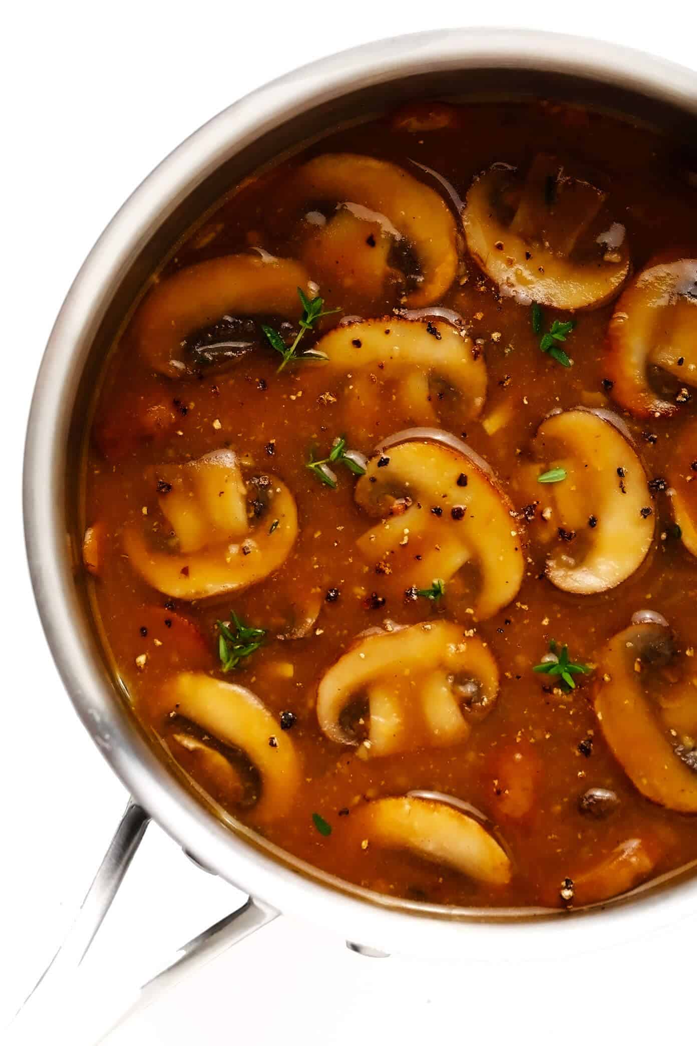 This easy make-ahead mushroom gravy recipe is naturally vegetarian (and vegan) and full of the best, rich, savory flavors. Perfect with mashed potatoes and more! | gimmesomeoven.com #mushroom #gravy #vegan #vegetarian #glutenfree #makeahead #thanksgiving #christmas #easter #holiday #healthy #dinner #side Mushroom Gravy in Saucepan