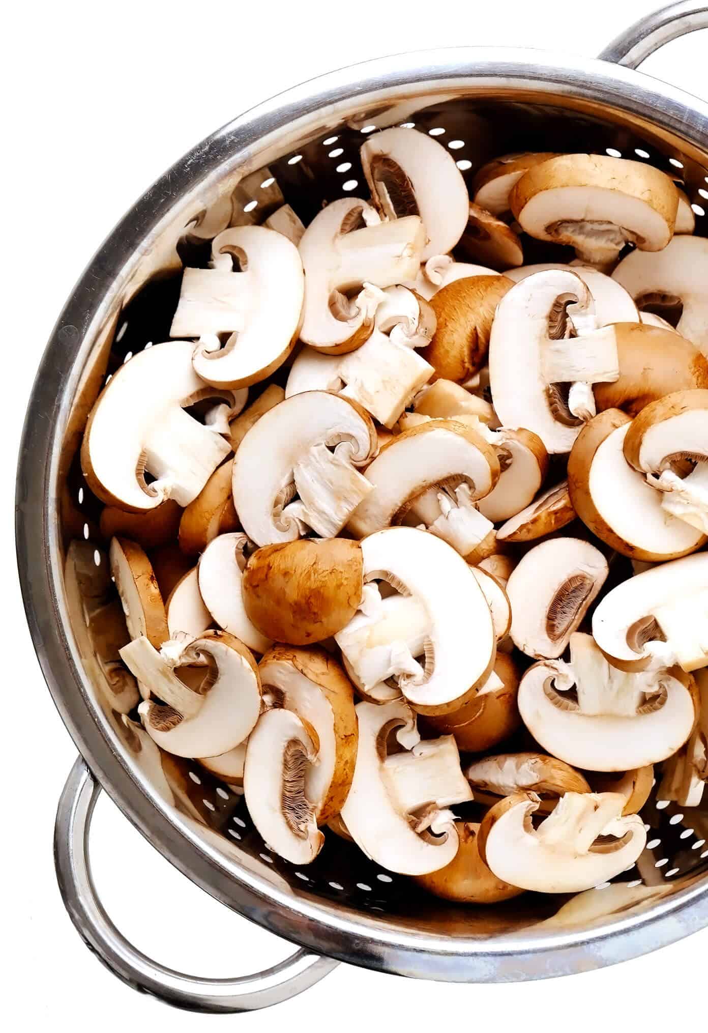 This easy make-ahead mushroom gravy recipe is naturally vegetarian (and vegan) and full of the best, rich, savory flavors. Perfect with mashed potatoes and more! | gimmesomeoven.com #mushroom #gravy #vegan #vegetarian #glutenfree #makeahead #thanksgiving #christmas #easter #holiday #healthy #dinner #side Baby Bella (Cremini) Mushrooms In Strainer