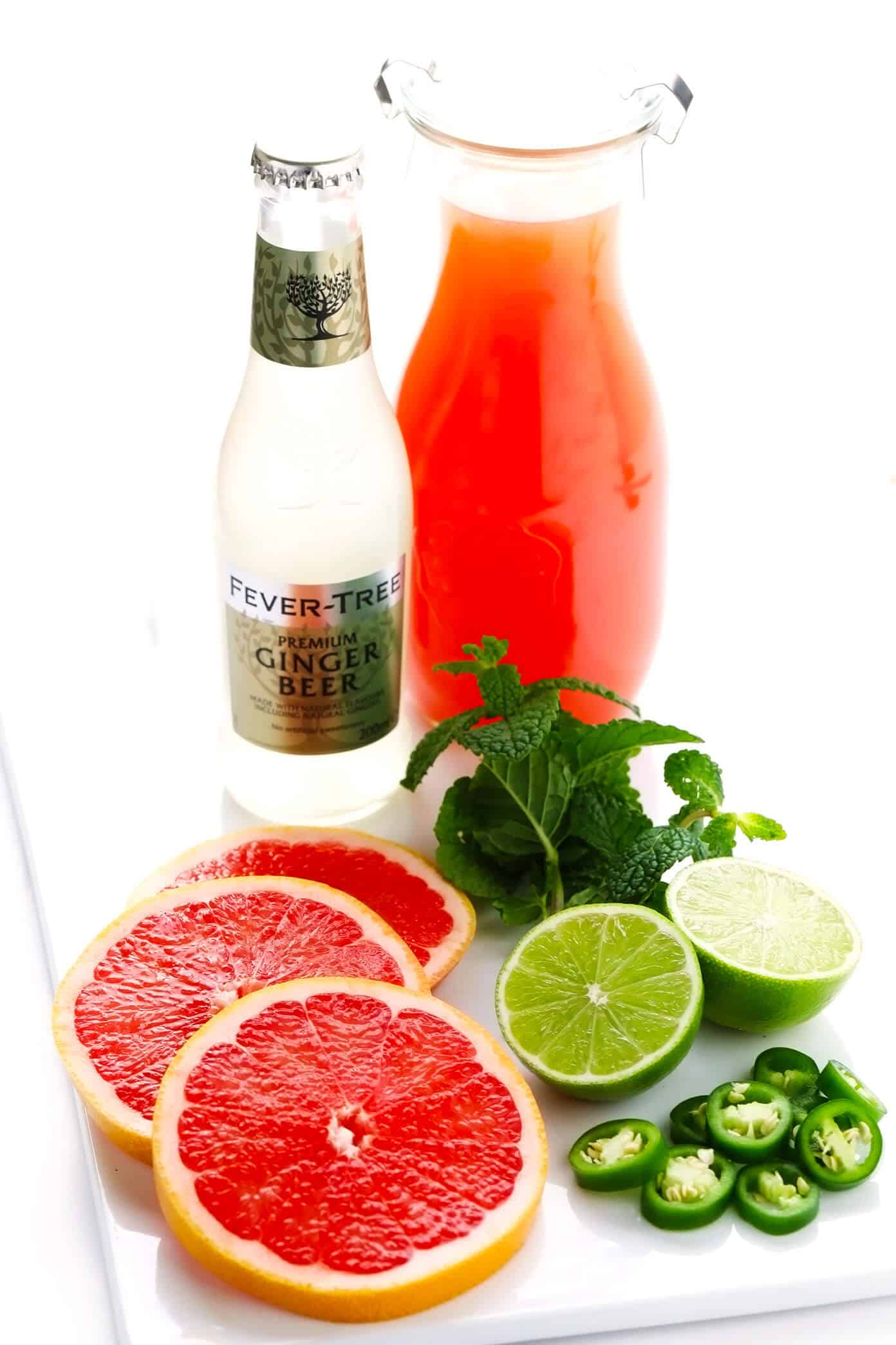 This Spicy Grapefruit Ginger Fizz mocktail is made with grapefruit juice, spicy ginger beer, fresh lime juice, mint, and jalapeño. It's easy to whip up in 5 minutes, minimally sweet, and so flavorful! | gimmesomeoven.com #mocktail #drink #gingerbeer #alcoholfree #grapefruit #spritzer Mocktail ingredients (grapefruit juice, ginger beer, grapefruit, lime, mint, jalapeno)