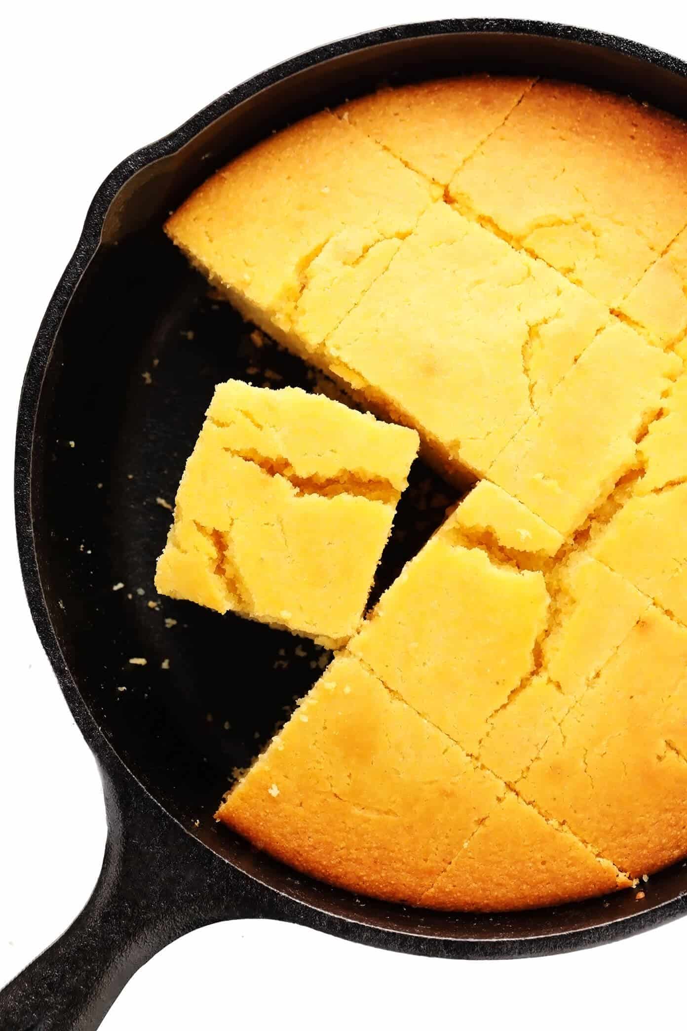 This amazing homemade cornbread recipe is lightly sweetened with honey, made extra moist with buttermilk, and tastes so buttery and delicious! Easy to make in a basic baking dish or cast iron skillet, or you can use this batter to make cornbread muffins. And perfect for serving with soup, chili, dressing/stuffing, or whatever sounds good! | gimmesomeoven.com #cornbread #bread #healthy #skillet #side #homemade #vegetarian #glutenfree Cast Iron Skillet Cornbread