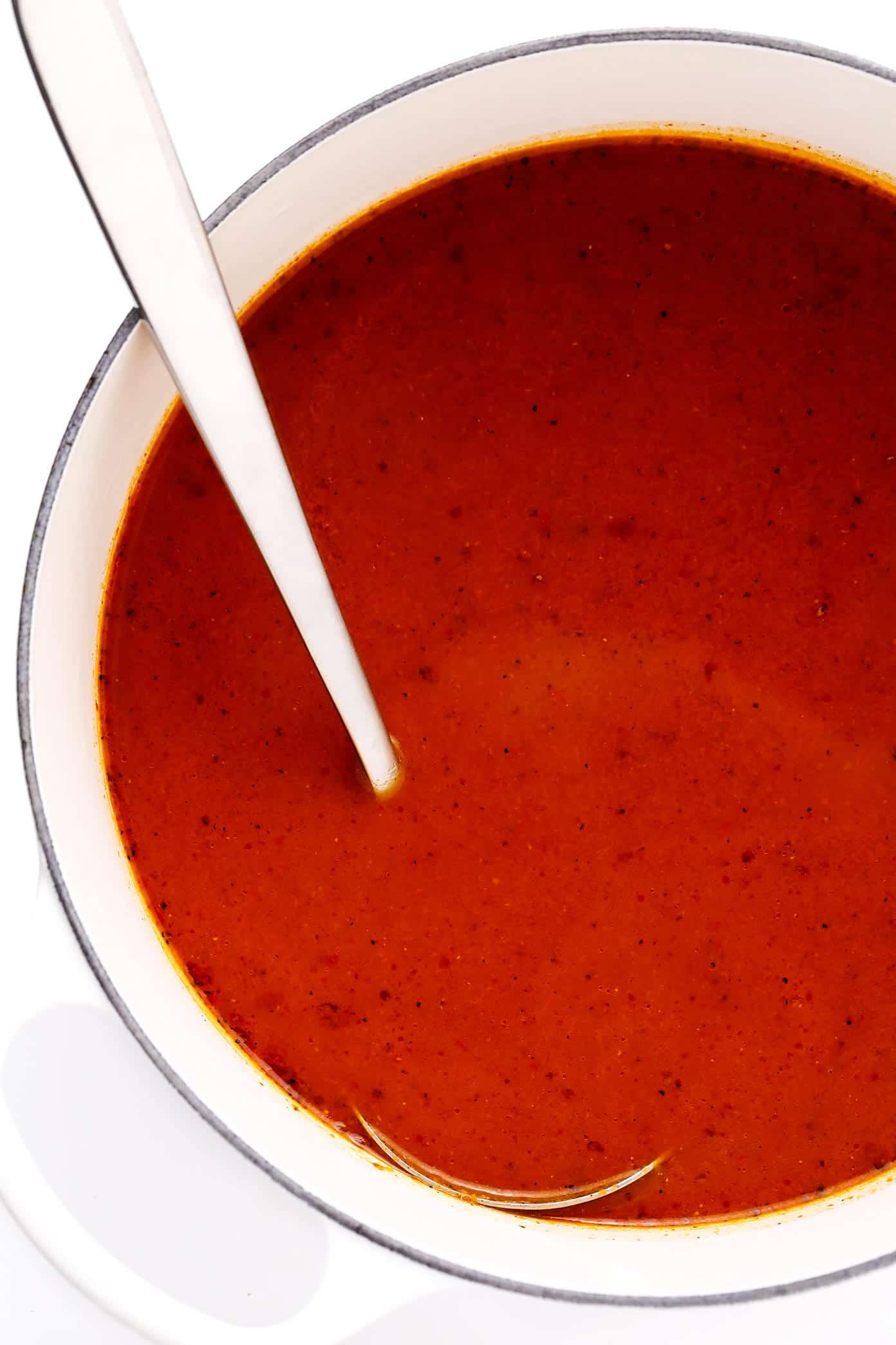 This traditional Sopa Azteca (Tortilla Soup) recipe is made with a simple, richly-seasoned, tomato-chile broth that is ladled hot over crispy tortilla strips and loaded up with your choice of toppings (avocado, cilantro, cheese, etc). This healthy Mexican soup is naturally vegan, vegetarian and gluten-free, but feel free to add chicken and/or cheese if you'd like! | gimmesomeoven.com #soup #mexican #tortilla #chicken #healthy #dinner #mealprep #vegetarian #vegan #glutenfree Caldo de Sopa Azteca (Tortilla Soup Broth)