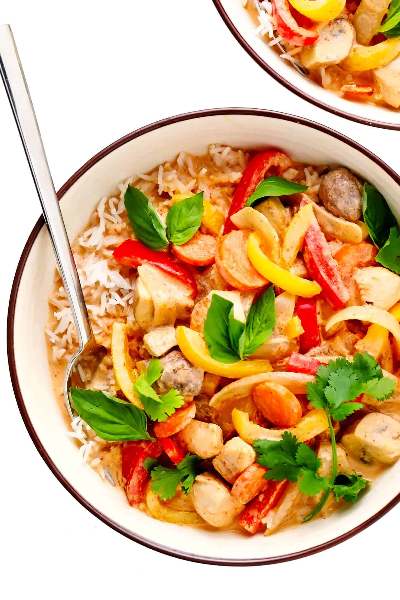 This cozy Thai Chicken Curry recipe is quick and easy to whip up in about 30 minutes, it's made with the yummiest Thai red coconut curry sauce, and it's easy to customize with your favorite veggies and proteins. Feel free to swap beef, pork, shrimp, tofu or vegetarian/vegan alternatives for the chicken and serve over rice, noodles, quinoa or on its own. | gimmesomeoven.com #thai #chicken #curry #stirfry #soup #asian #healthy #glutenfree #dinner #vegetable Thai Chicken Curry