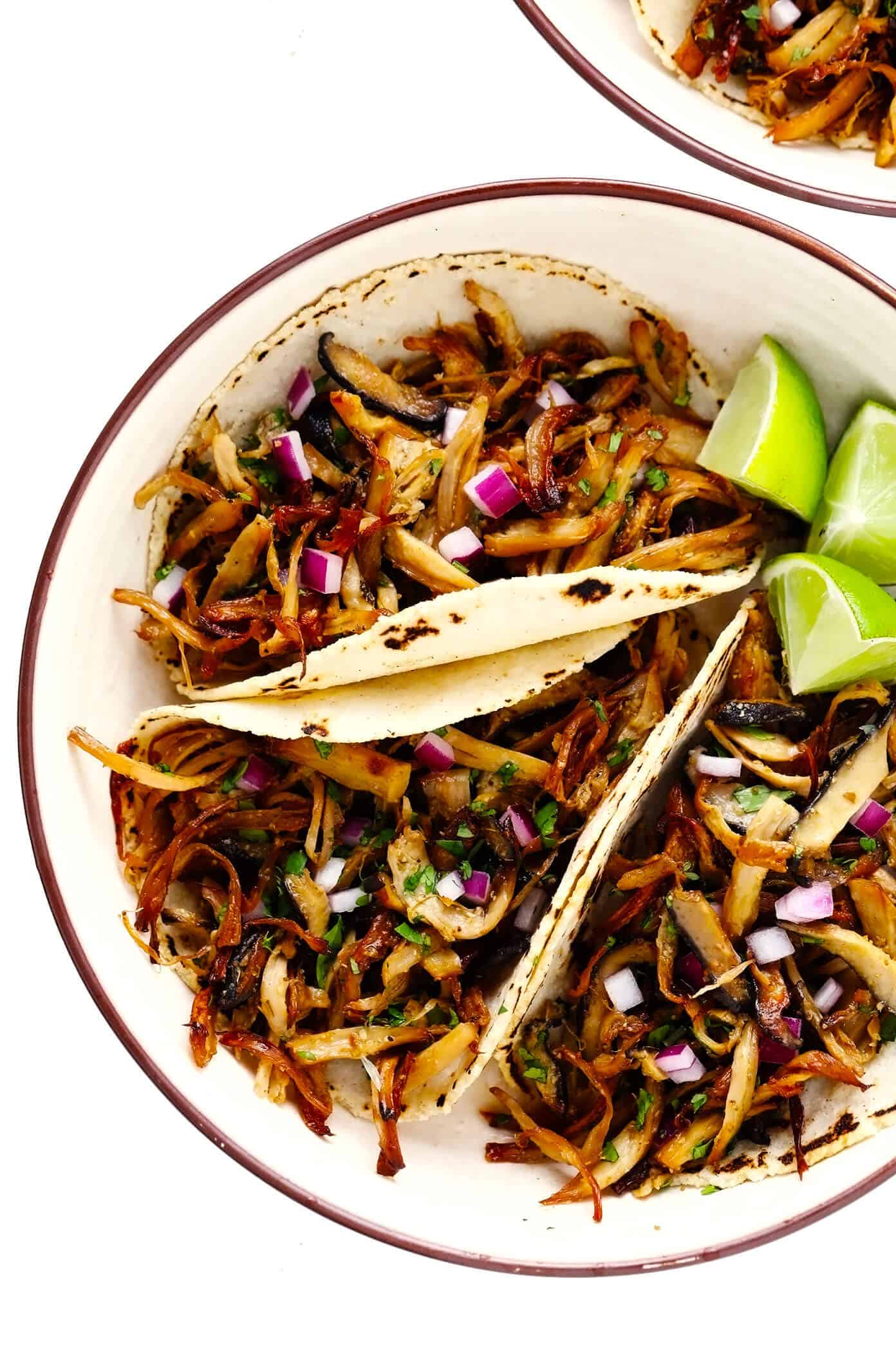 This Mexican mushroom "carnitas" recipe is fun and easy make with marinated shredded mushrooms that are roasted to crispy, juicy, delicious perfection! Vegetarian, vegan, gluten-free, and perfect for tacos, burritos, quesadillas and more. | gimmesomeoven.com #mushroom #carnitas #roasted #vegetarian #vegan #glutenfree #healthy #dinner #tacos Mushroom "Carnitas" Tacos (Vegetarian, Vegan, Gluten-Free)