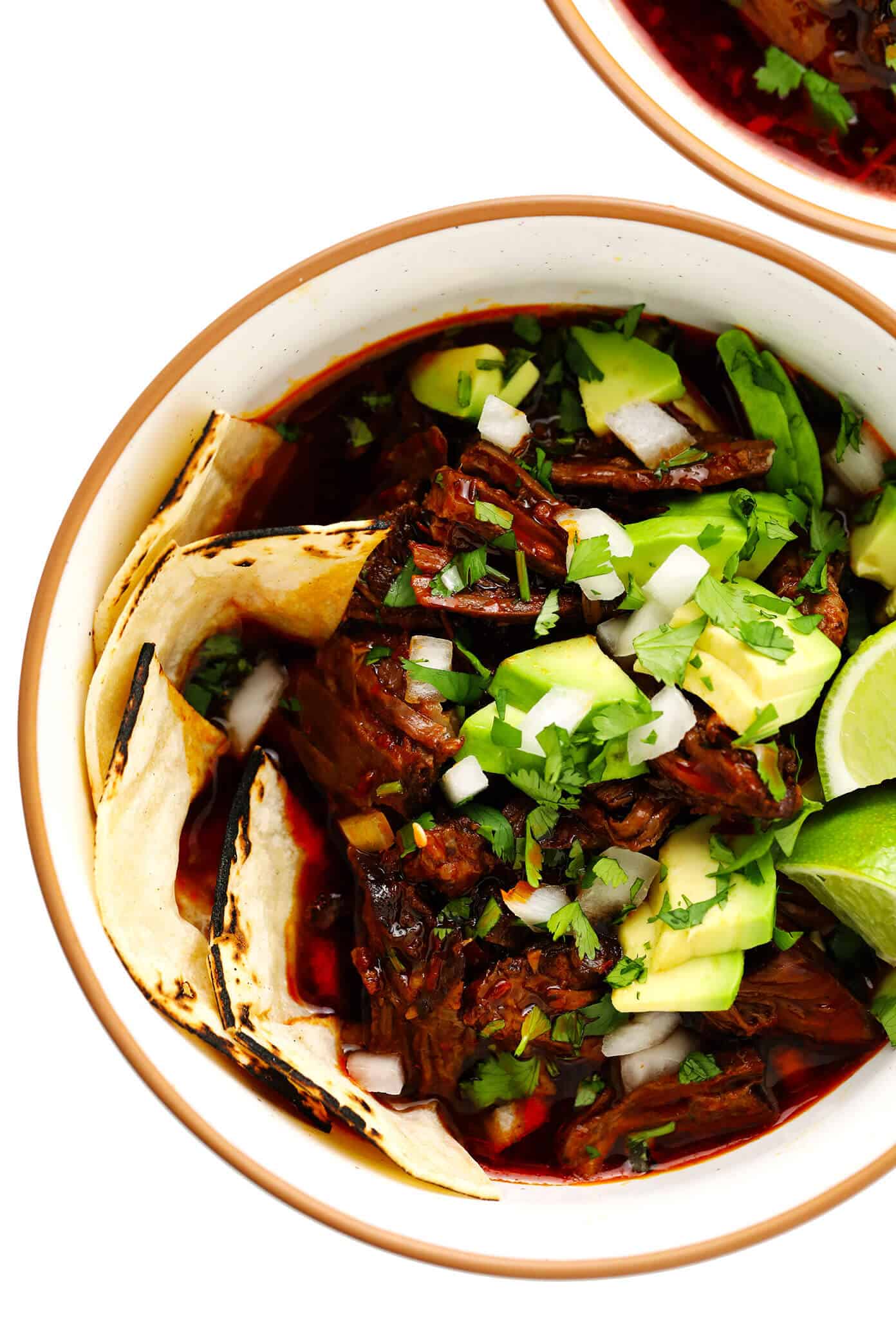 This delicious birria recipe (Mexican beef stew) is SO flavorful and comforting, and it's easy to make in Crock-Pot, Instant Pot or on the stovetop. Serve it as a simple stew or use this recipe to make birria tacos (or fried cheesy birria quesatacos) dipped in consomme! | gimmesomeoven.com #birria #stew #tacos #beef #crockpot #slowcooker #instantpot #pressurecooker #dinner #mexican Birria Beef Stew in Bowls