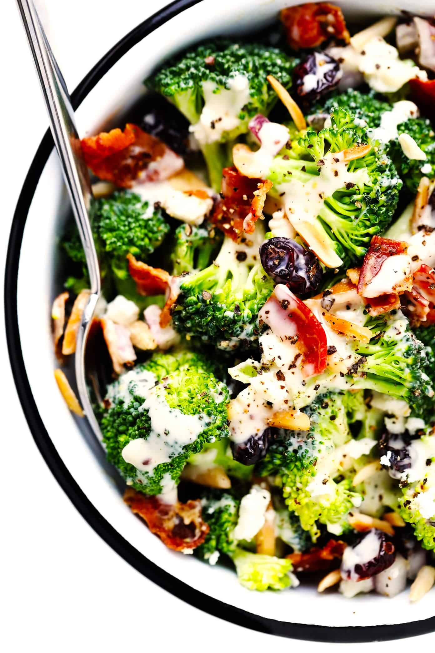 This classic broccoli salad recipe is made with fresh broccoli florets, crispy bacon, dried cranberries, toasted almonds, red onion, feta cheese, and a lightened-up creamy dressing. It's the perfect make-ahead side dish for picnics and potlucks and is always a crowd fave! | gimmesomeoven.com Broccoli Salad