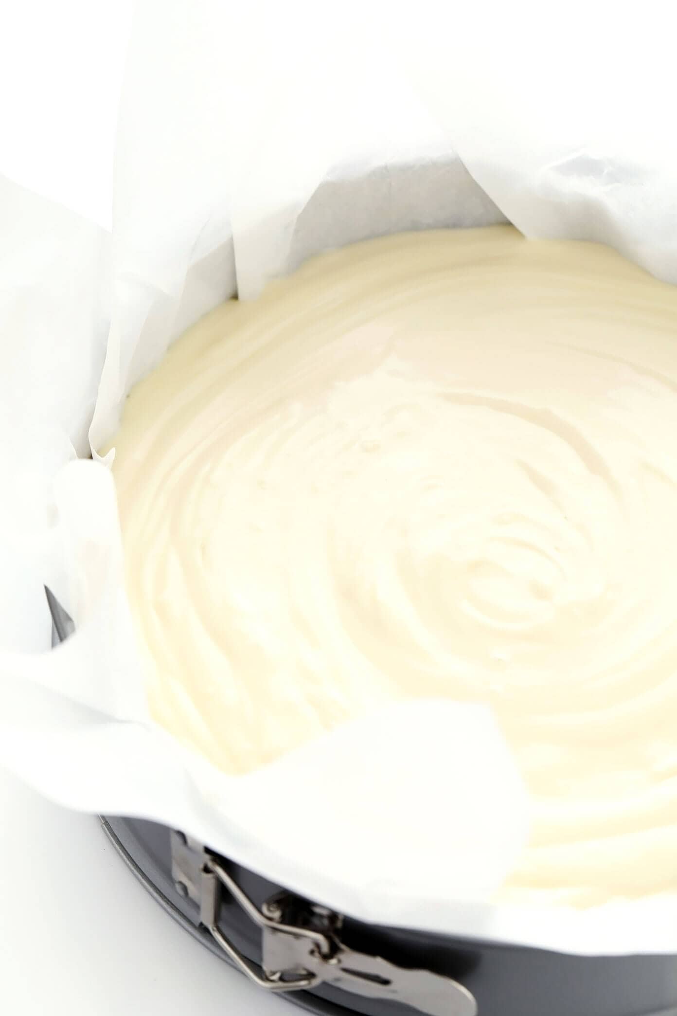 This "Burnt" Basque Cheesecake recipe (known here in Spain as 'tarta de queso') is uniquely light, creamy, delicious, caramelized, and so easy to make that it's nearly foolproof! Such a great dessert recipe for all occasions. | gimmesomeoven.com #basque #cheesecake #spanish #spain #sansebastian #dessert #tartadequeso #caramelized How To Make Basque Cheesecake -- Batter in Springform Pan