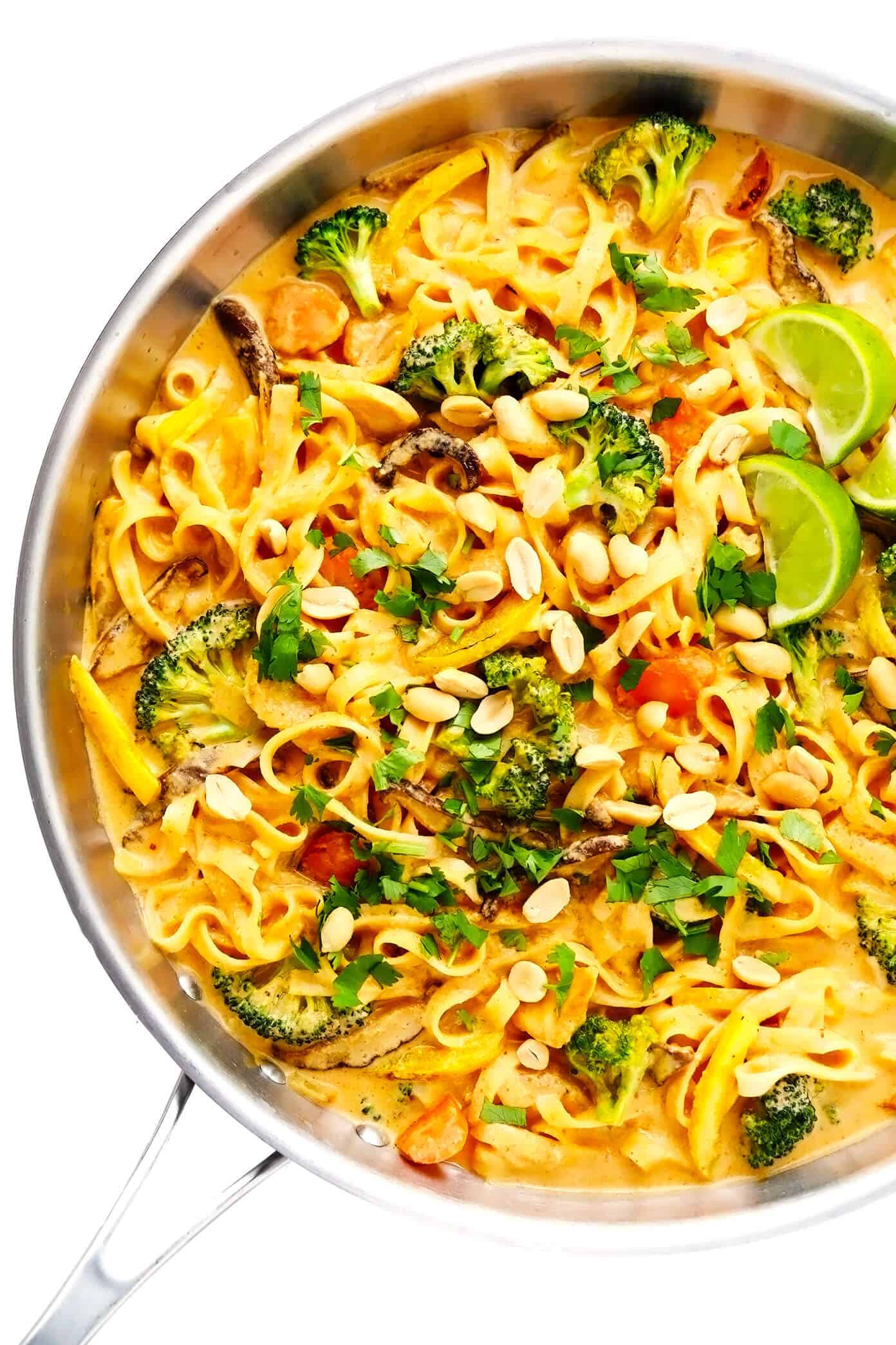 This Saucy Thai Curried Peanut Noodles is made with the yummiest creamy coconut curry peanut sauce and your choice of noodles, veggies and protein. A great 35-minute easy dinner recipe that's naturally gluten-free and easy to make vegetarian or vegan, if you'd like! | gimmesomeoven.com #curry #noodles #peanut #vegetable #chicken #healthy #stirfry #thai #sauce #dinner #pasta Thai Coconut Curry Peanut Noodles in Saute Pan
