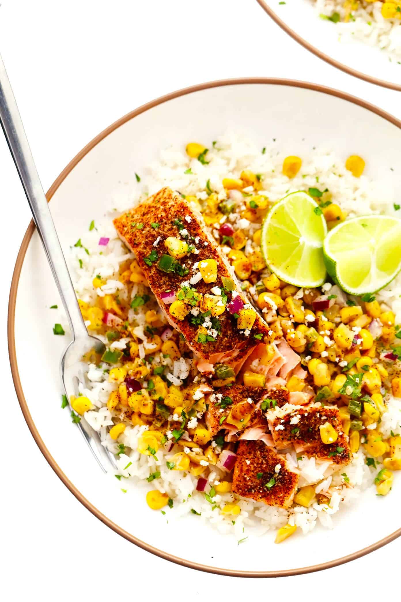 This Chili Lime Salmon recipe (baked or pan-seared) is easy to make and topped with the most delicious esquites (Mexican creamy corn salsa). Served over rice or quinoa, this healthy, gluten-free dinner recipe is full of amazing flavor and ready to go in less than 30 minutes! | gimmesomeoven.com Chili Lime Salmon with Esquites and Rice in Bowl