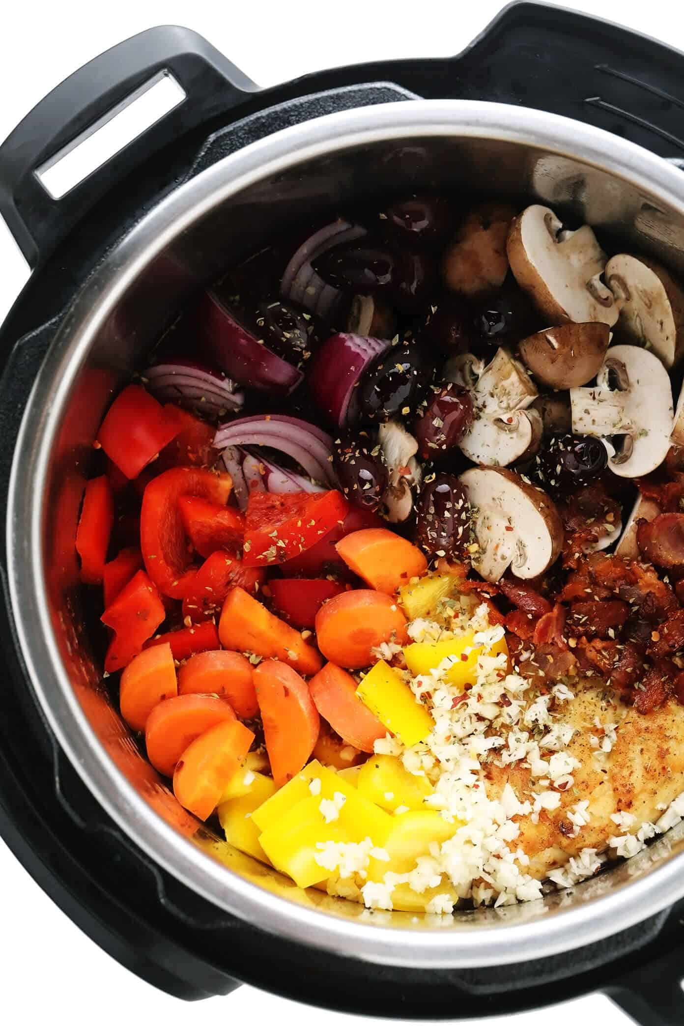 This chicken cacciatore recipe is easy to make with your choice of veggies and simmered in a flavorful garlic-herb tomato sauce. Easy to make in either the Instant Pot, Crock-Pot or on the stovetop and delicious served over pasta or polenta. Always a great dinner recipe for Italian night! | gimmesomeoven.com Chicken Cacciatore Ingredients in Instant Pot