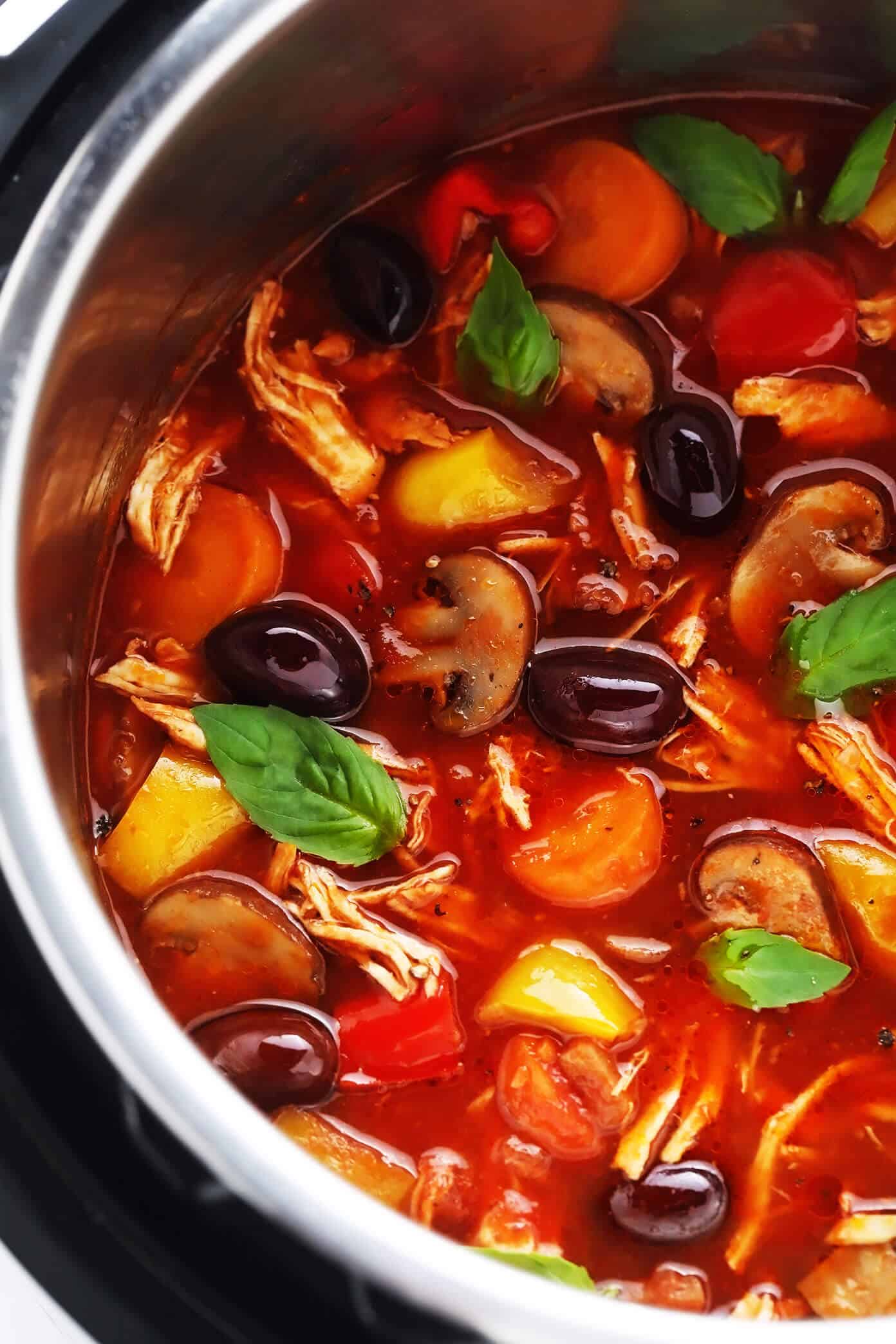 This chicken cacciatore recipe is easy to make with your choice of veggies and simmered in a flavorful garlic-herb tomato sauce. Easy to make in either the Instant Pot, Crock-Pot or on the stovetop and delicious served over pasta or polenta. Always a great dinner recipe for Italian night! | gimmesomeoven.com Chicken Cacciatore