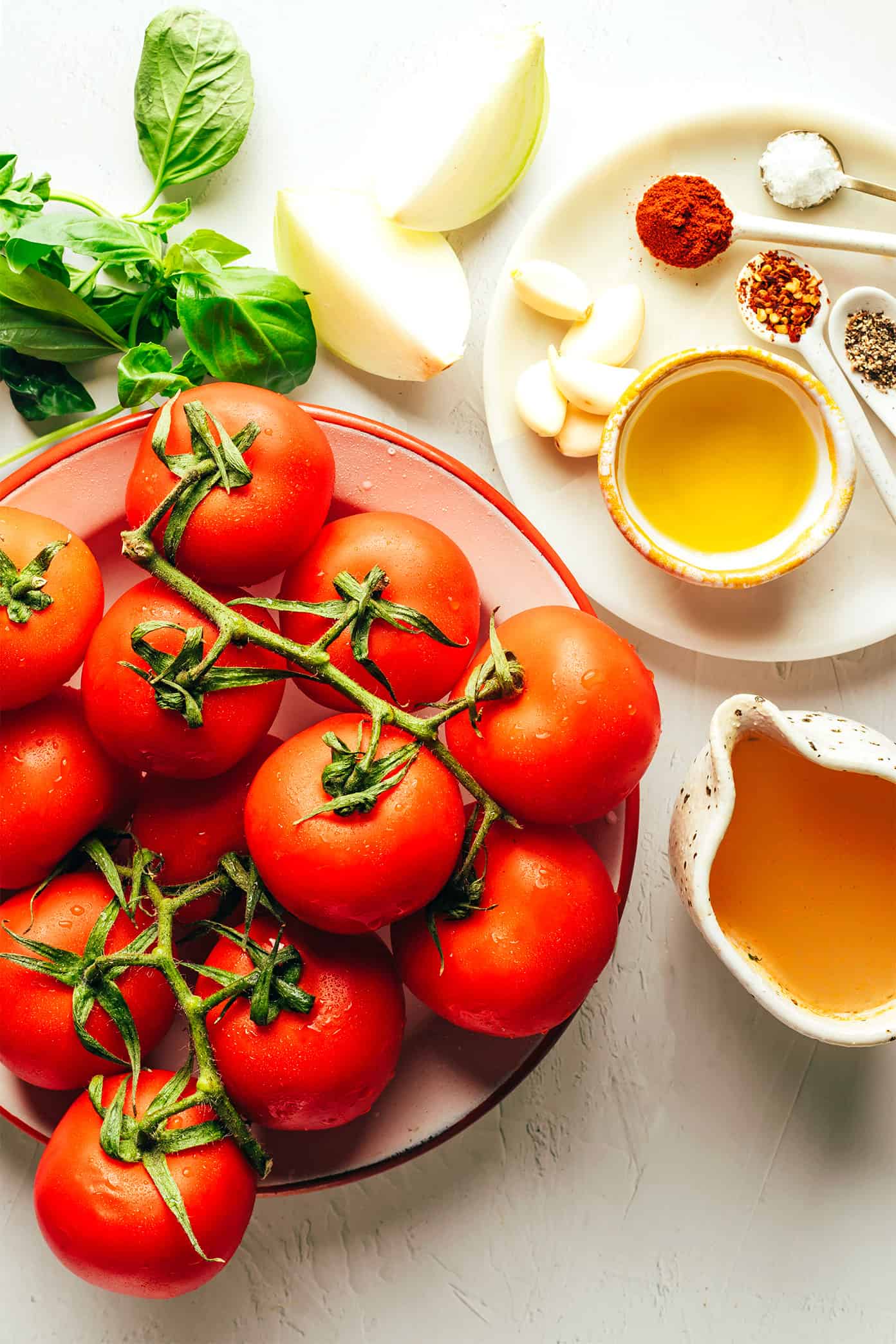 This roasted tomato soup recipe always tastes so fresh and flavorful and it's easy to make with a handful of simple ingredients. Feel free to add cream or croutons if you'd like! | gimmesomeoven.com Roasted Tomato Soup Ingredients