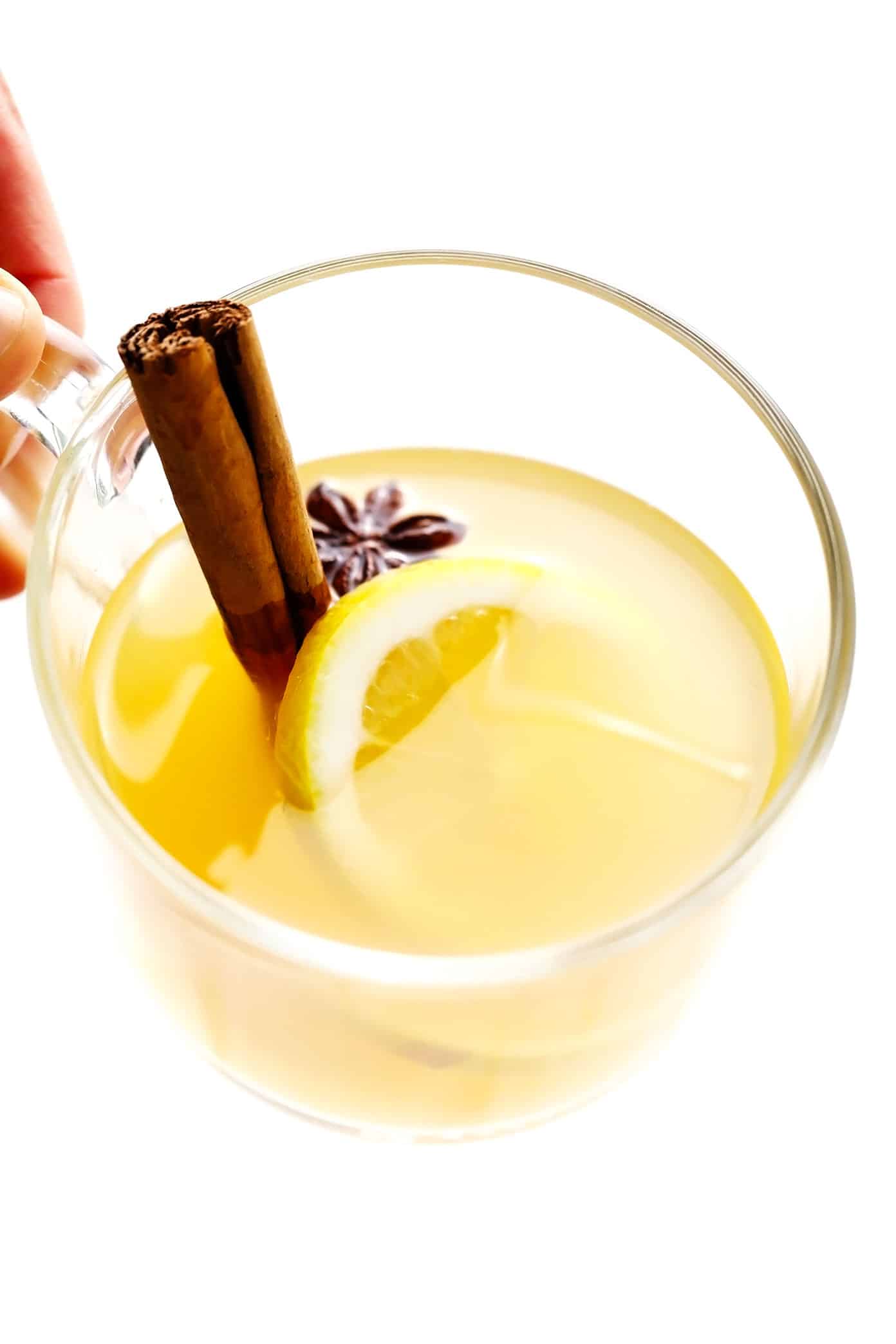 This classic hot toddy recipe is easy to make in just 5 minutes with hot water, whiskey, lemon and honey. Feel free to use your favorite type of whiskey for this cocktail, plus any additional add-ins (I recommend fresh ginger) or garnishes (such as cinnamon, star anise or citrus twists) that you enjoy. You can also omit the alcohol altogether to make this a non-alcoholic drink. | gimmesomeoven.com Hot Toddy Mug with Cinnamon, Ginger and Star Anise