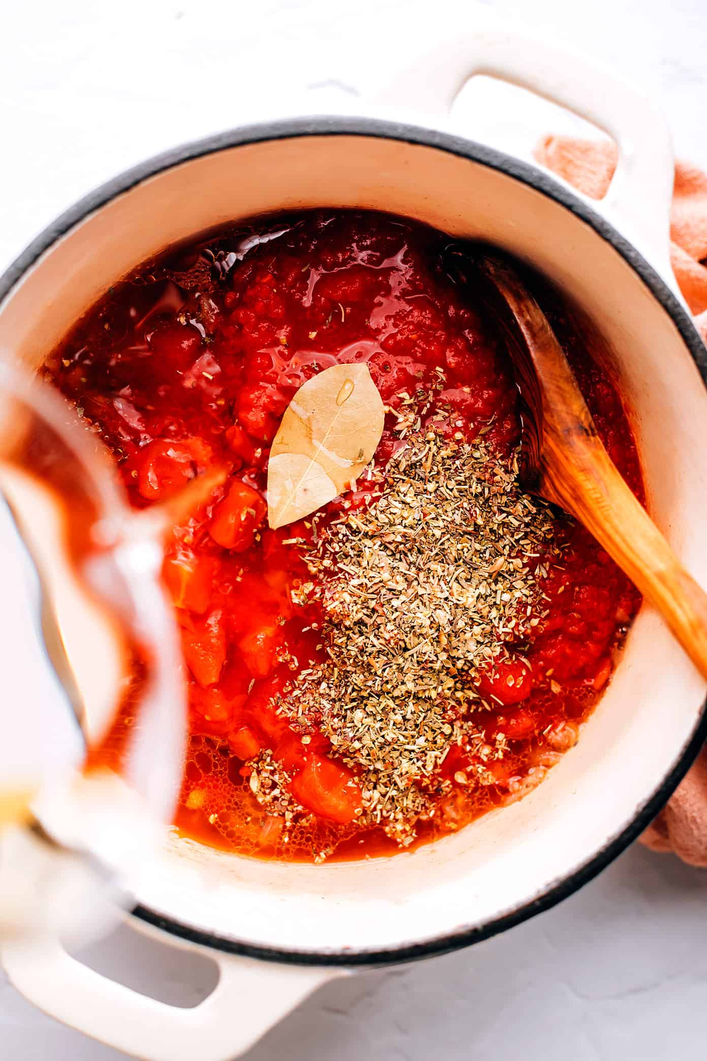 This easy lasagna soup recipe is made with Italian sausage (traditional or plant-based), a garlicky tomato herb broth, your choice of pasta, and three types of cheese (hello, mozzarella, ricotta AND Parmesan). Easy to make vegetarian, vegan and/or gluten-free if you'd like. And always such a cozy Italian 30-minute dinner recipe! | gimmesomeoven.com Making the broth for lasagna soup