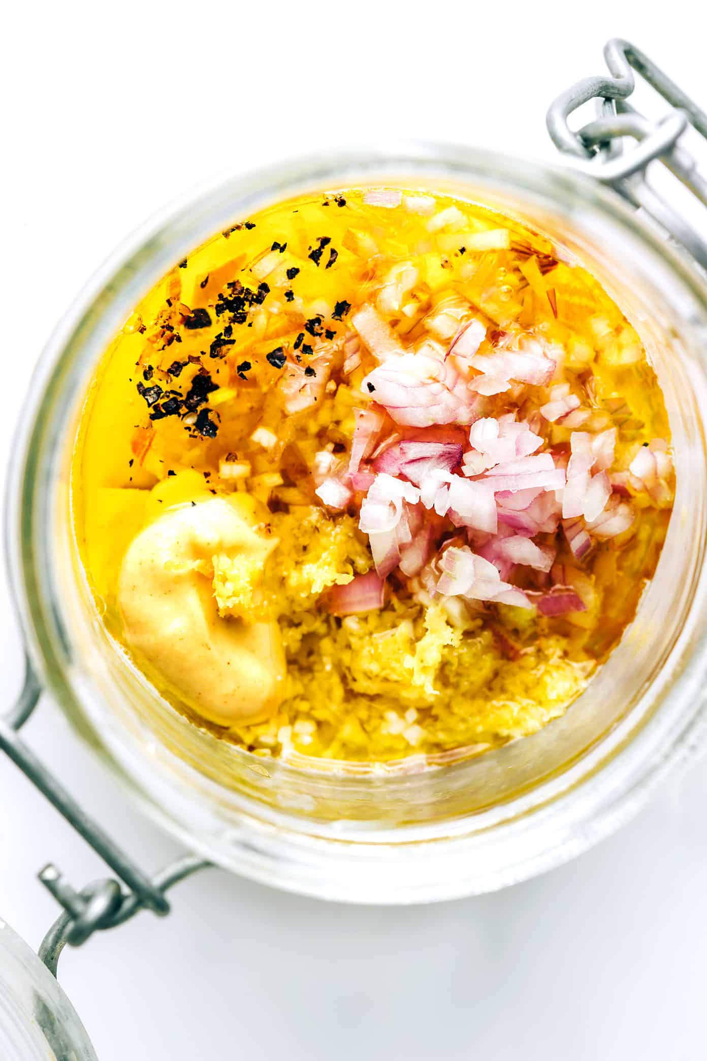 This delicious shallot vinaigrette (French vinaigrette) is quick and easy to make in 5 minutes with fresh lemon juice, garlic, Dijon, olive oil, salt and pepper. It's a versatile salad dressing that goes with just about everything, and always tastes so light and lovely. | gimmesomeoven.com Shallot Vinaigrette in Jar