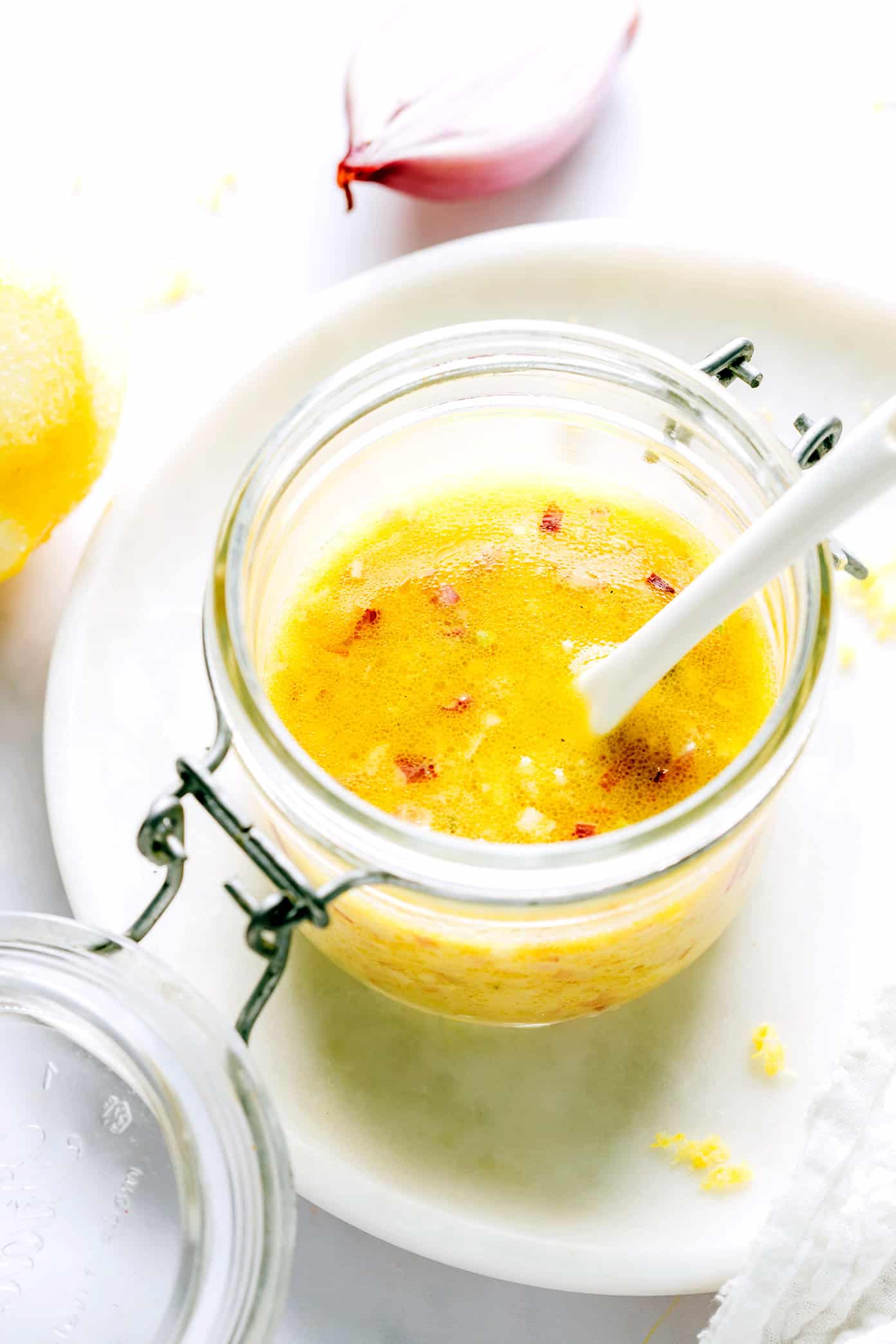 This delicious shallot vinaigrette (French vinaigrette) is quick and easy to make in 5 minutes with fresh lemon juice, garlic, Dijon, olive oil, salt and pepper. It's a versatile salad dressing that goes with just about everything, and always tastes so light and lovely. | gimmesomeoven.com Shallot Vinaigrette (French Vinaigrette)