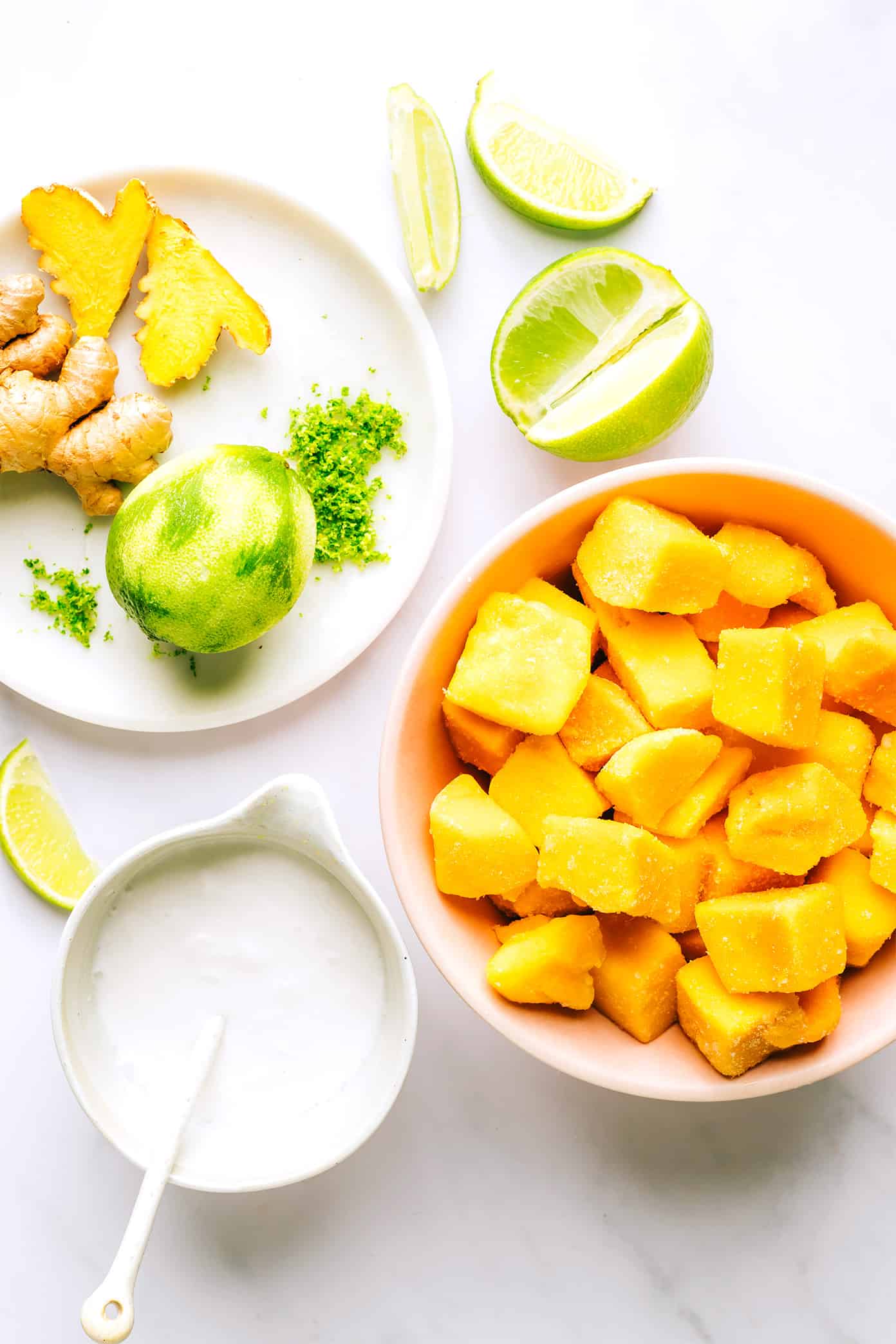 This 5-minute mango lime sorbet is easy to make in a food processor or blender, and made with a delicious blend of mango, lime, coconut milk and fresh ginger. It's the perfect refreshing dessert for summer entertaining, and naturally gluten-free, dairy-free, vegetarian and vegan. | gimmesomeoven.com Mango Lime Sorbet Ingredients (frozen mango, fresh ginger, coconut milk, lime)