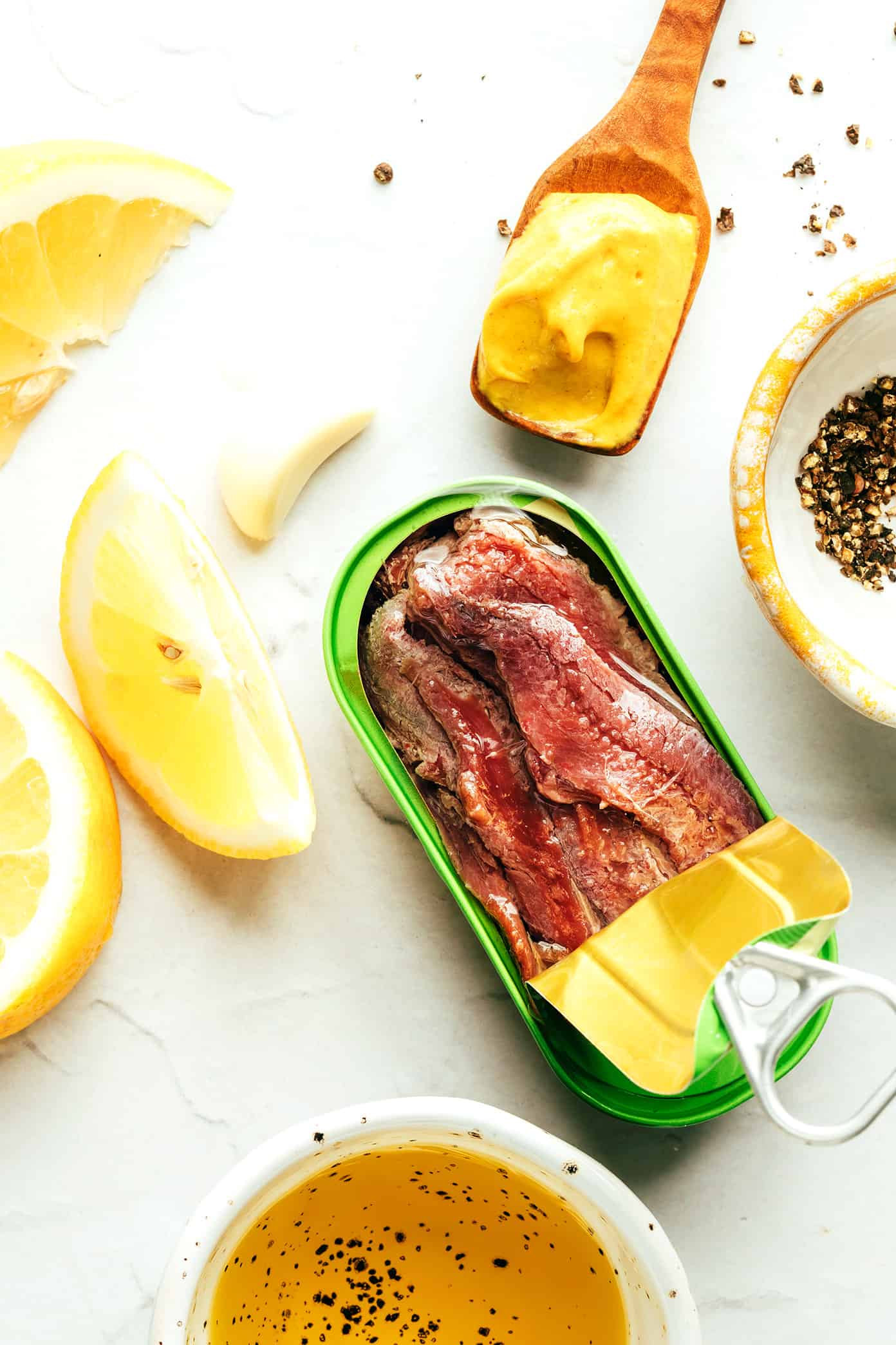 This "caesar-ish" dressing (anchovy vinaigrette) recipe is quick and easy to make with just 5 simple ingredients, and it's full of the most delicious, bold, savory, umami flavors. Perfect for tossing with salads, pasta, vegetables, seafood, meat, burgers, or whatever else sounds good! | gimmesomeoven.com Anchovy vinaigrette ingredients