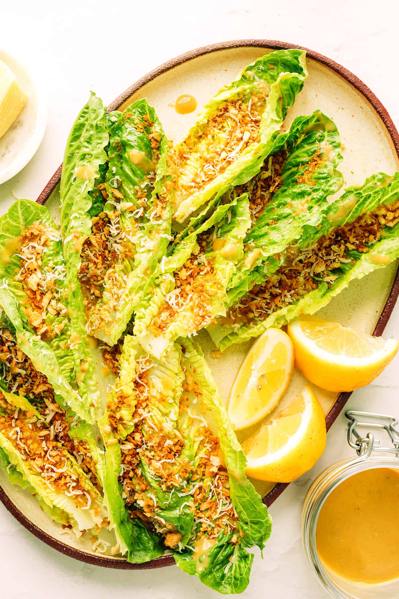 This "caesar-ish" dressing (anchovy vinaigrette) recipe is quick and easy to make with just 5 simple ingredients, and it's full of the most delicious, bold, savory, umami flavors. Perfect for tossing with salads, pasta, vegetables, seafood, meat, burgers, or whatever else sounds good! | gimmesomeoven.com Caesar-ish salad with Parmesan breadcrumbs