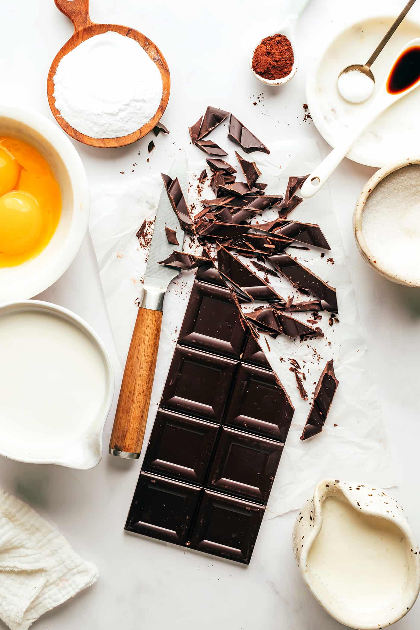 This no-bake chocolate pots de crème recipe comes together with just 20 minutes of active prep time and features a silky-smooth chocolate custard topped with amaretto whipped cream. Naturally gluten-free and the perfect make-ahead dessert for easy entertaining! | gimmesomeoven.com Easy Chocolate Pots de Creme Ingredients