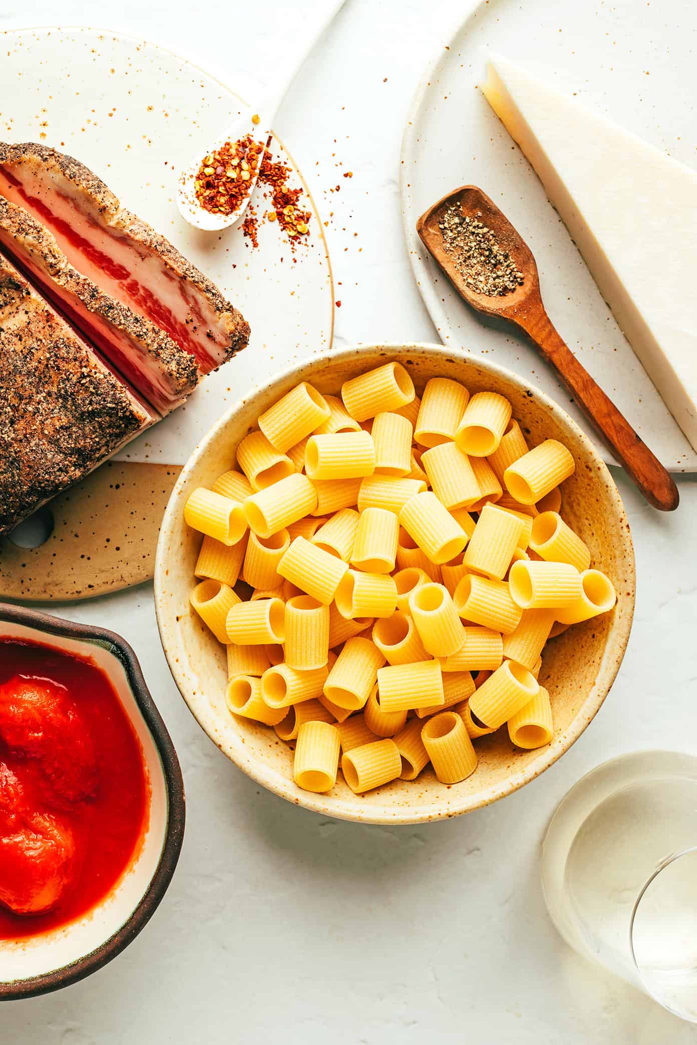 This classic Italian Pasta all'Amatriciana recipe is easy to make with 6 traditional ingredients (guanciale, Pecorino Romano, white wine, tomatoes, chili pepper, and pasta) and full of the best rich and savory flavors. Feel free to make the pasta with spaghetti, bucatini, rigatoni or whatever pasta shape you love best. | gimmesomeoven.com Amatriciana Ingredients