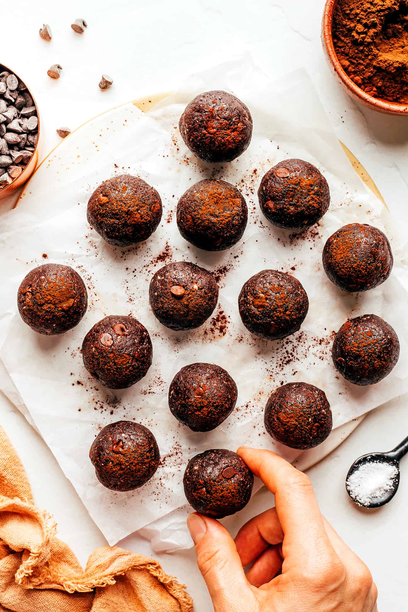 These salted chocolate brownie bites are quick and easy to make with nuts (almonds and walnuts), dates, cocoa powder, vanilla, sea salt and mini chocolate chips. A tasty breakfast, dessert, or snack made with healthier ingredients to satisfy those chocolate cravings! | gimmesomeoven.com Full batch of Salted Chocolate Brownie Bites