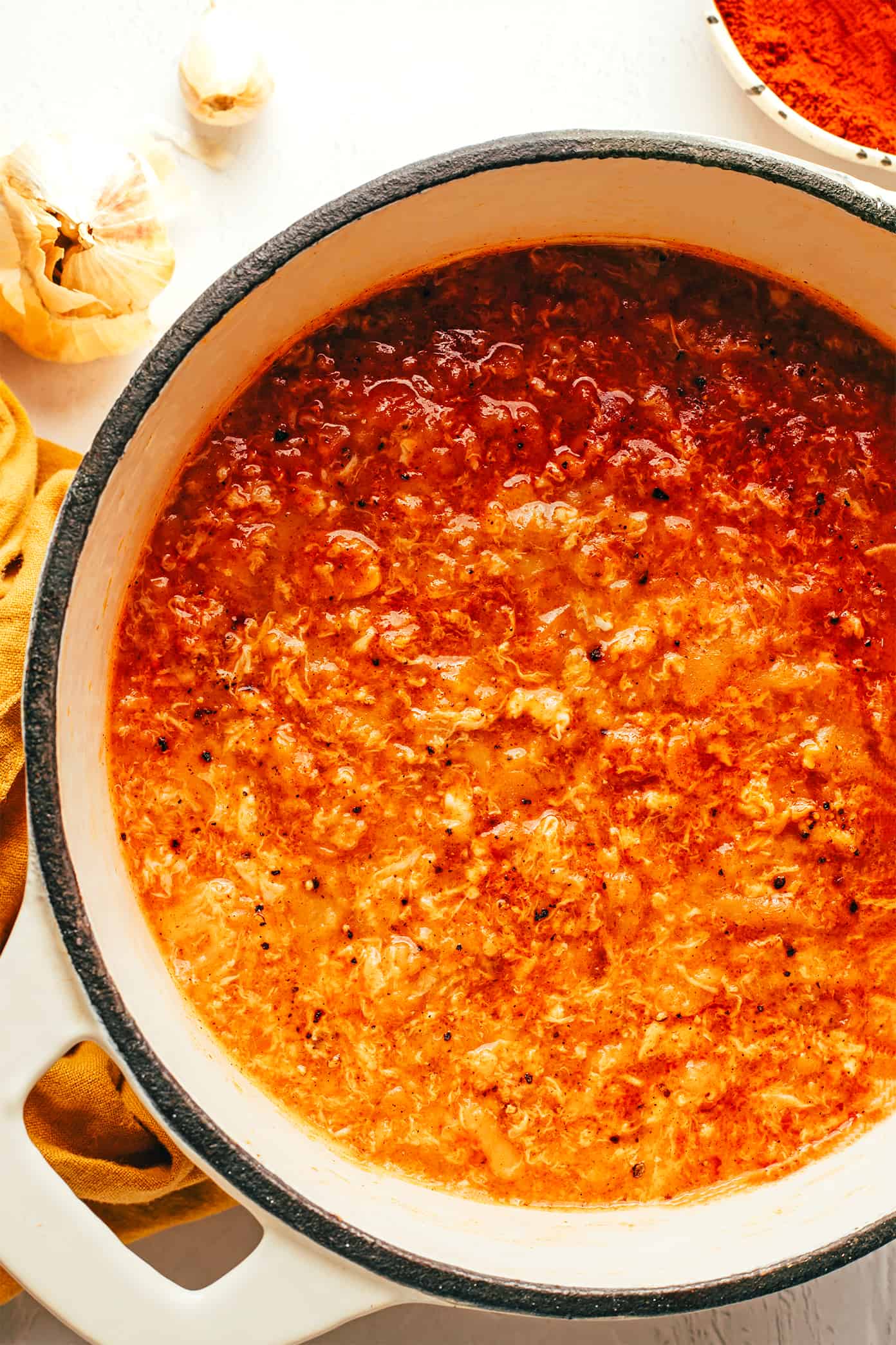 Spanish sopa de ajo (garlic soup or sopa castellana) is incredibly easy to make with just garlic, bread, eggs, broth, olive oil, and smoked paprika. It's a simple vegetarian dinner recipe that comes together in less than 30 minutes and always tastes so flavorful and comforting. | gimmesomeoven.com Sopa de Ajo (Sopa Castellana) in Pot
