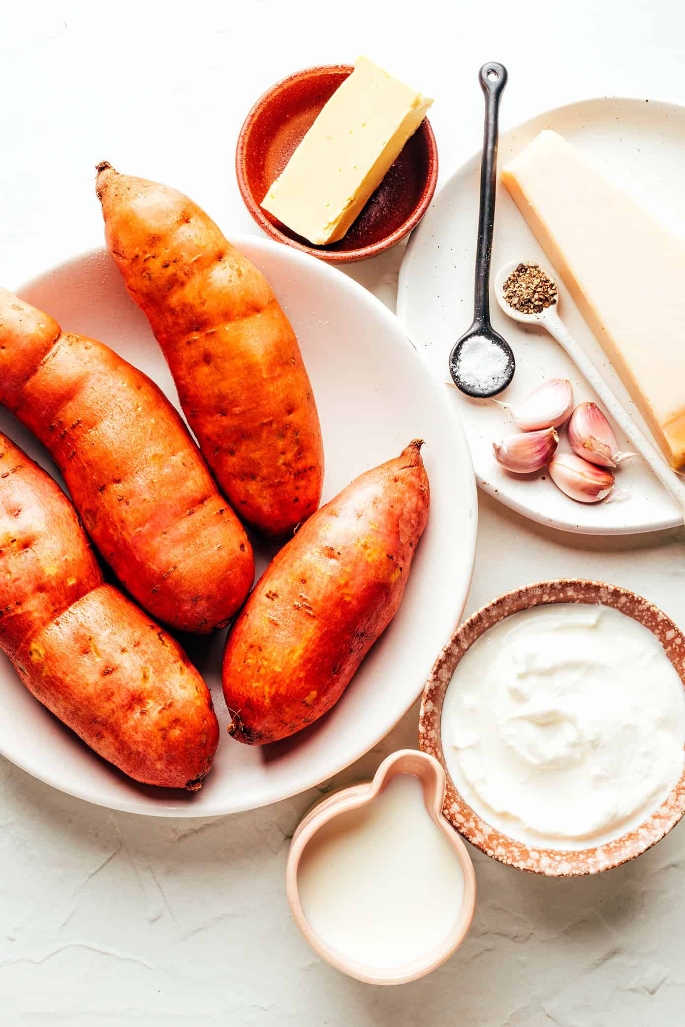 This Garlic Parmesan Mashed Sweet Potatoes recipe is easy to make, irresistibly sweet and savory, and sooo good. They're the perfect side dish for Thanksgiving or anytime you're craving some sweet potatoes! (Vegetarian + Gluten-Free) | gimmesomeoven.com Garlic Parmesan Mashed Sweet Potato Ingredients