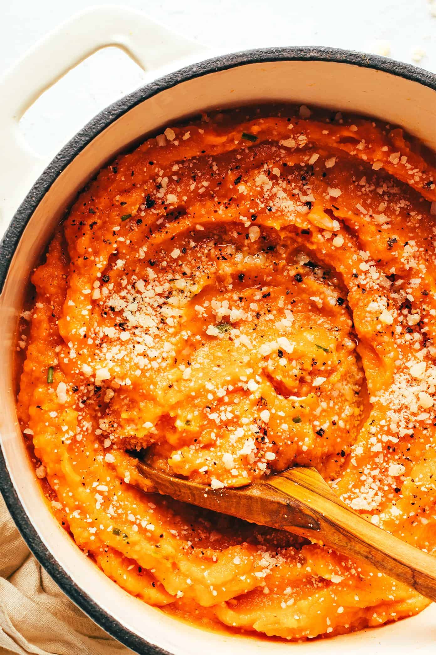 This Garlic Parmesan Mashed Sweet Potatoes recipe is easy to make, irresistibly sweet and savory, and sooo good. They're the perfect side dish for Thanksgiving or anytime you're craving some sweet potatoes! (Vegetarian + Gluten-Free) | gimmesomeoven.com Garlic Parmesan Mashed Sweet Potatoes in Pot