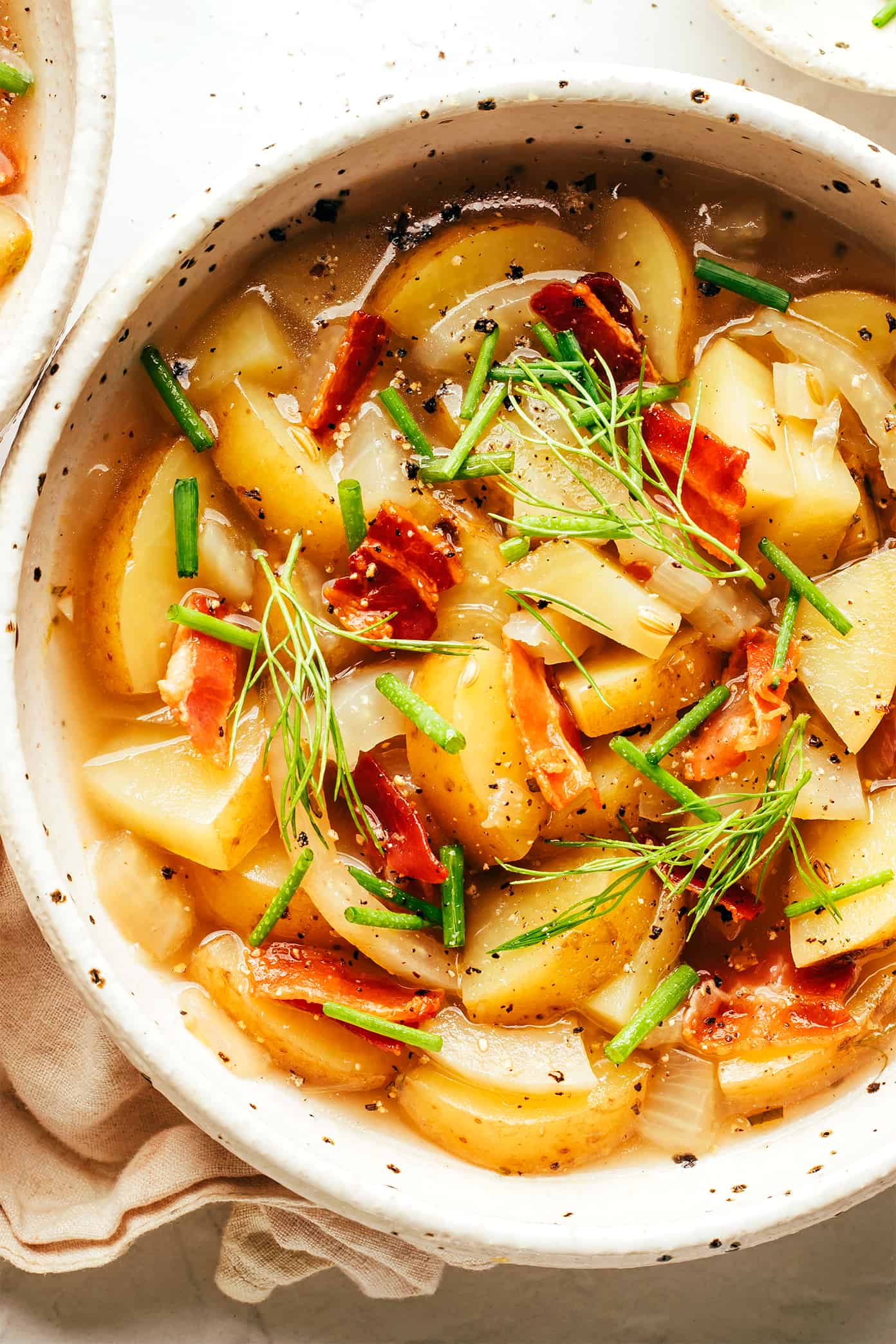 This potato bacon fennel soup recipe is incredibly easy to make and simmered in a garlic-rosemary broth. Easy to make, naturally gluten-free, and always such a cozy and delicious dinner recipe! | gimmesomeoven.com Potato Bacon Fennel Soup