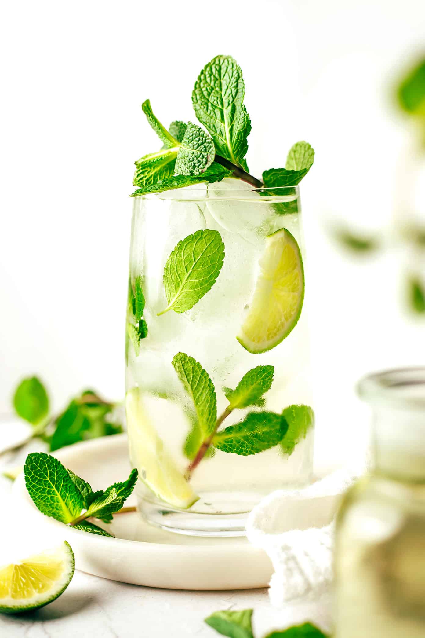 Fresh mint tea is easy to make hot or iced and always tastes so refreshing. Feel free to add sweetener and citrus (lemon or lime) too if you'd like. | gimmesomeoven.com Iced Fresh Mint Tea in Glass