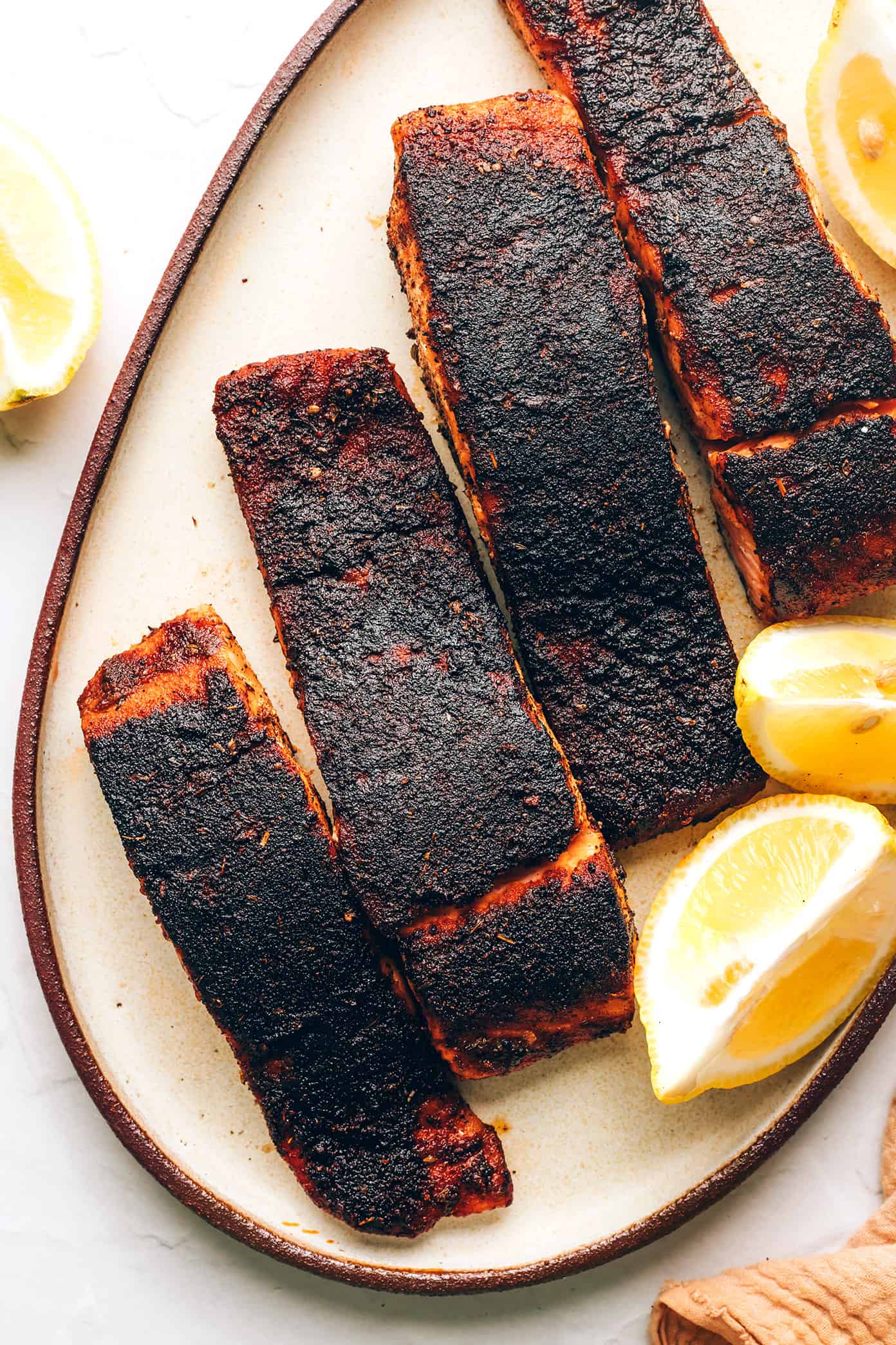 My favorite blackened salmon recipe is easy to make in 20 minutes and features a perfectly-blackened, flavorful, crispy crust. Always such a delicious, quick, and healthy dinner recipe! | gimmesomeoven.com Blackened Salmon with Lemon