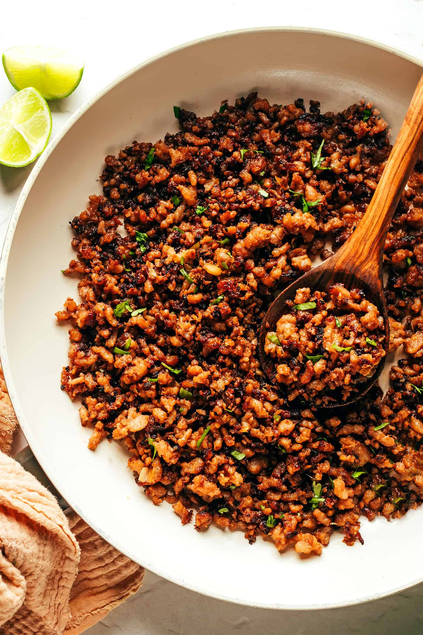 This Ginger Lime Pork with Coconut Rice recipe comes together in just 30 minutes and is bursting with sweet and savory flavors. It's also naturally gluten-free, easily adaptable with chicken, beef, turkey or seitan, and always makes for a delicious quick dinner. | gimmesomeoven.com Caramelized Ginger Lime Pork in Saute Pan