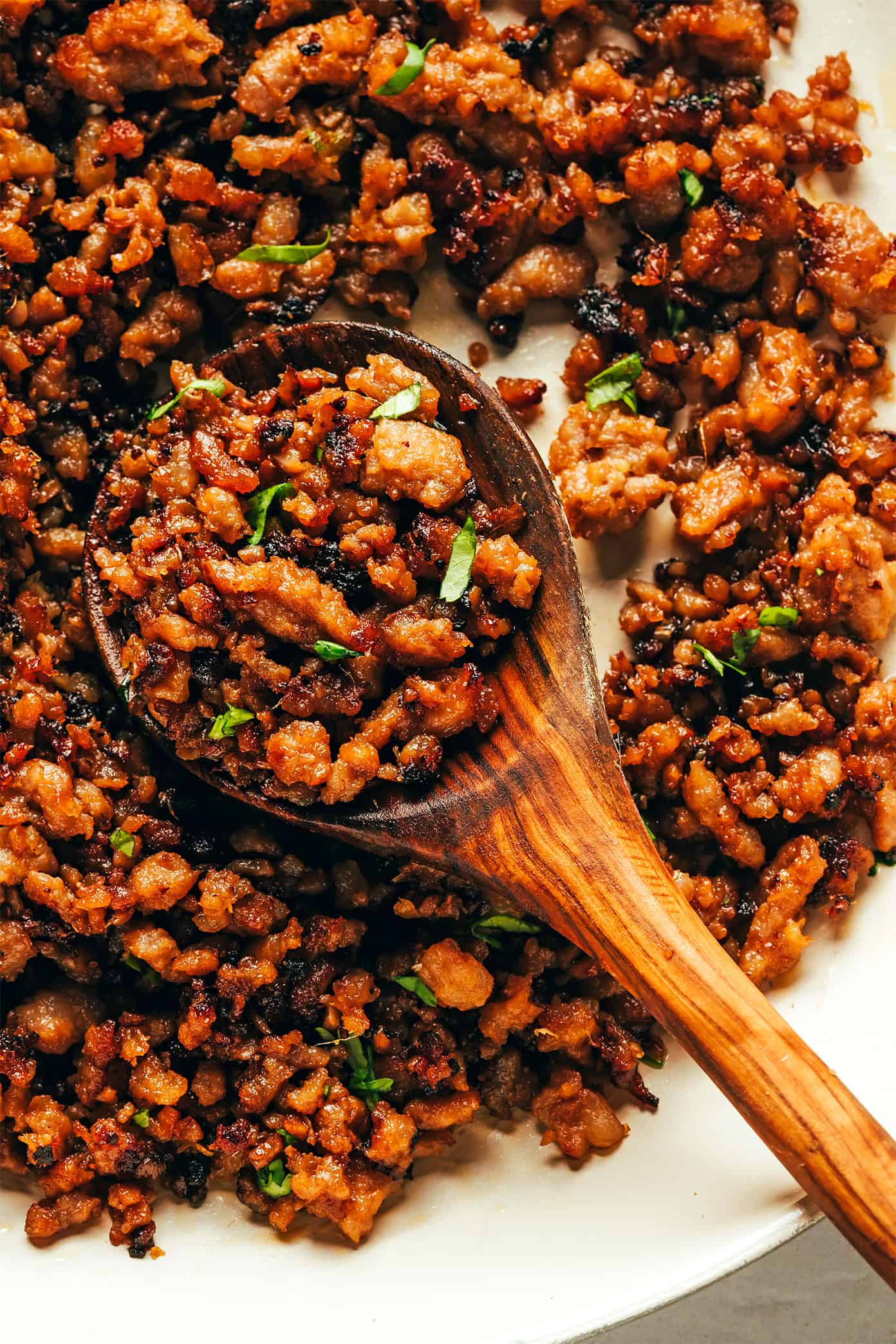 This Ginger Lime Pork with Coconut Rice recipe comes together in just 30 minutes and is bursting with sweet and savory flavors. It's also naturally gluten-free, easily adaptable with chicken, beef, turkey or seitan, and always makes for a delicious quick dinner. | gimmesomeoven.com Caramelized Pork Closeup